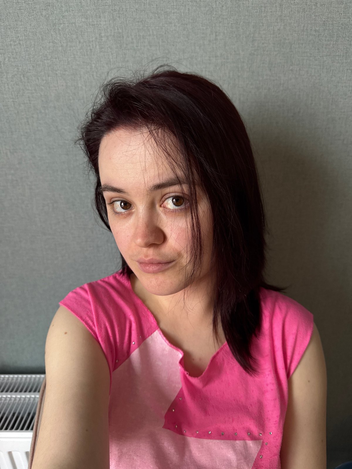 Portrait photograph captured in Izhevsk showing woman in pink shirt