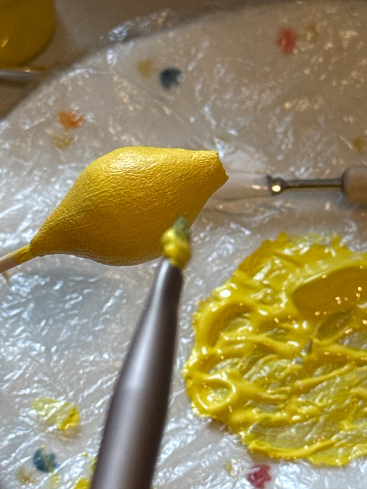 Handmaking lemon cake pops with paint and sculpting tools