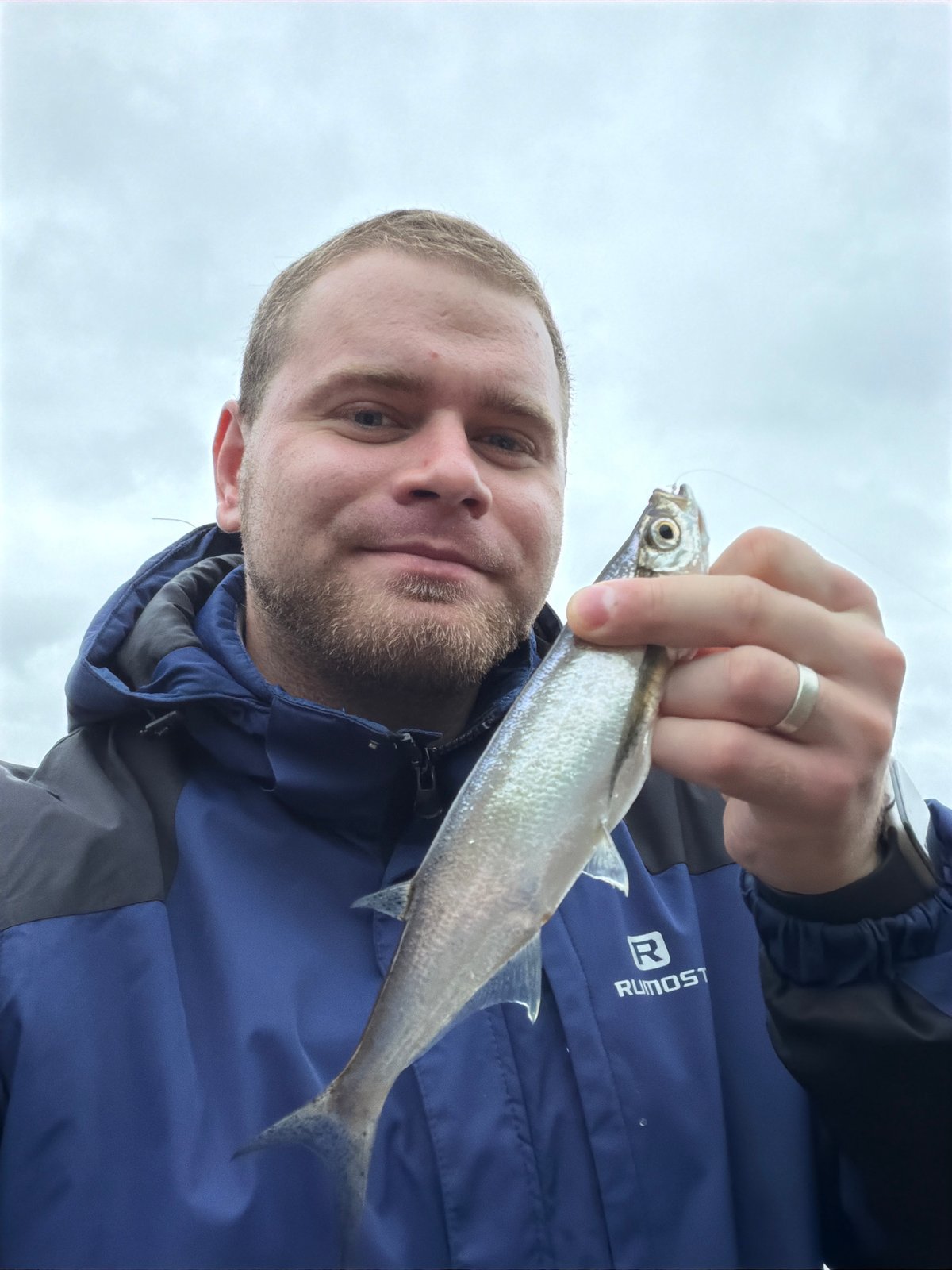 Man photographed in close-up under overcast sky in Noviy, Russia