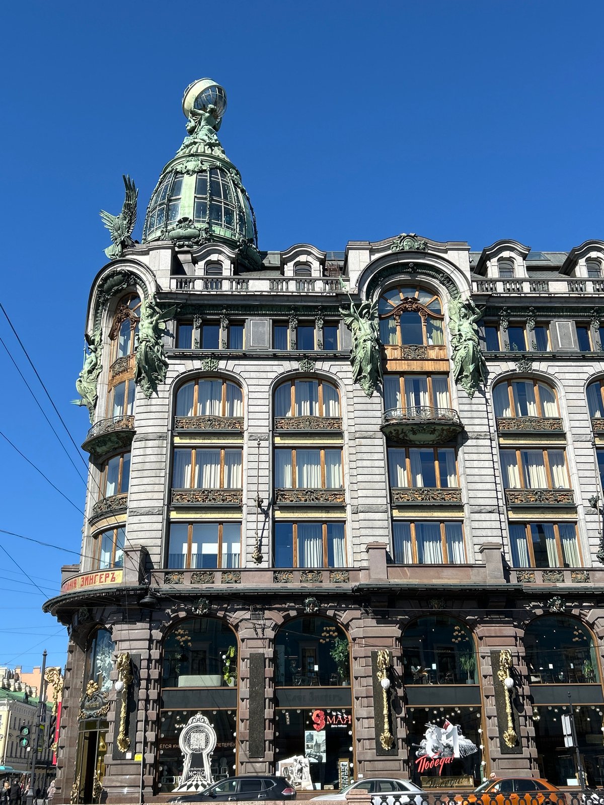 Industrial climbers maintain building facade near Singer House, St. Petersburg