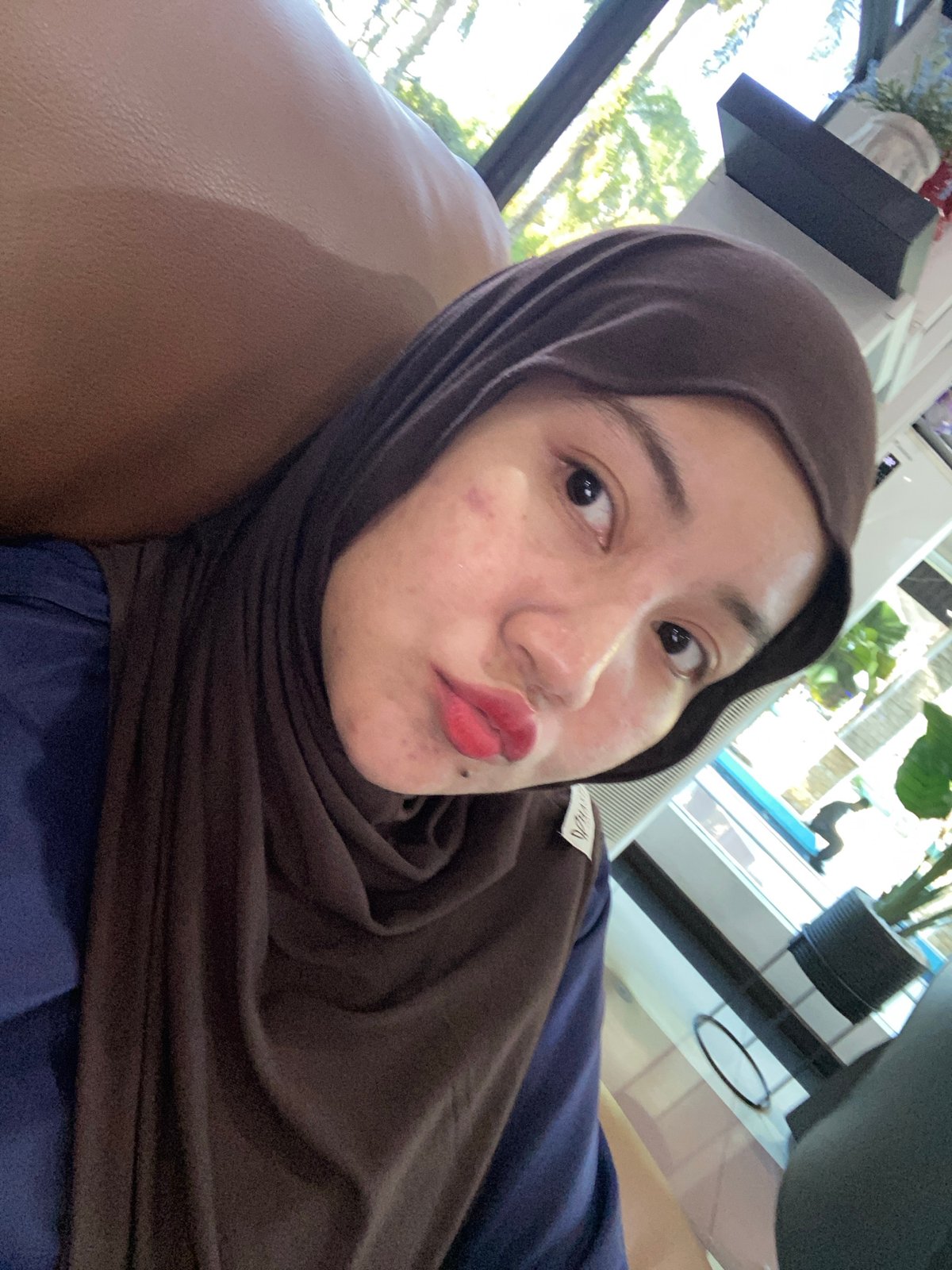 Selfies and waiting room scenes at a PLN office in Banjarbaru
