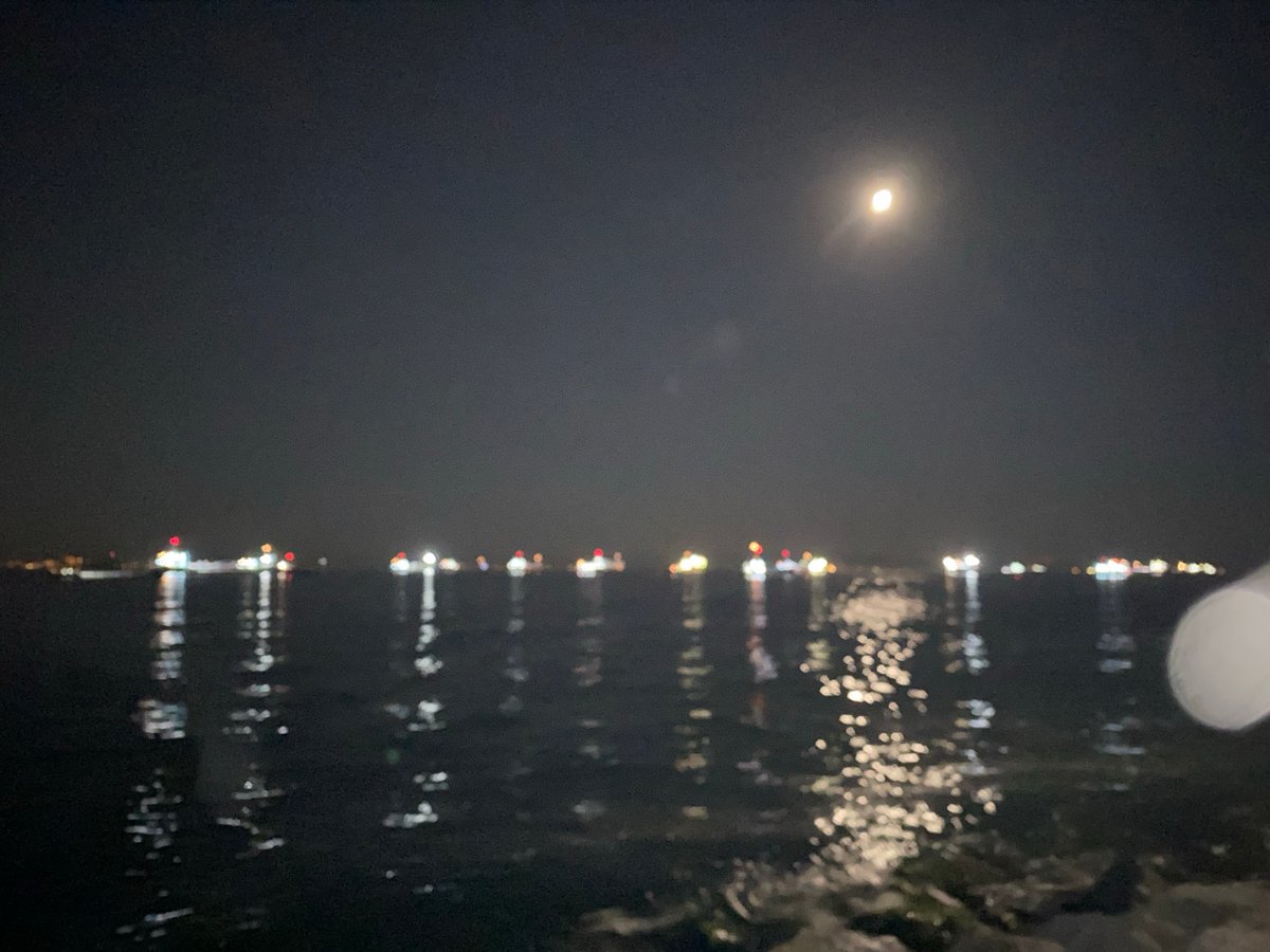 Ships and moonlight on the Istanbul waterfront at night