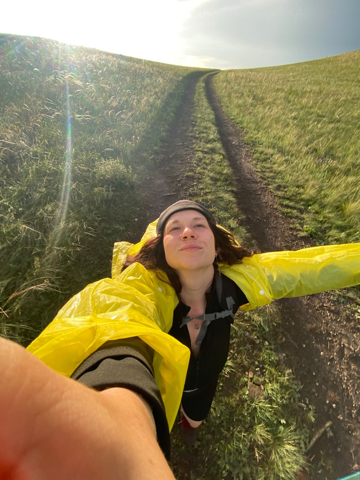 Hiking Verkhneozernoe hills with rainbow after rain