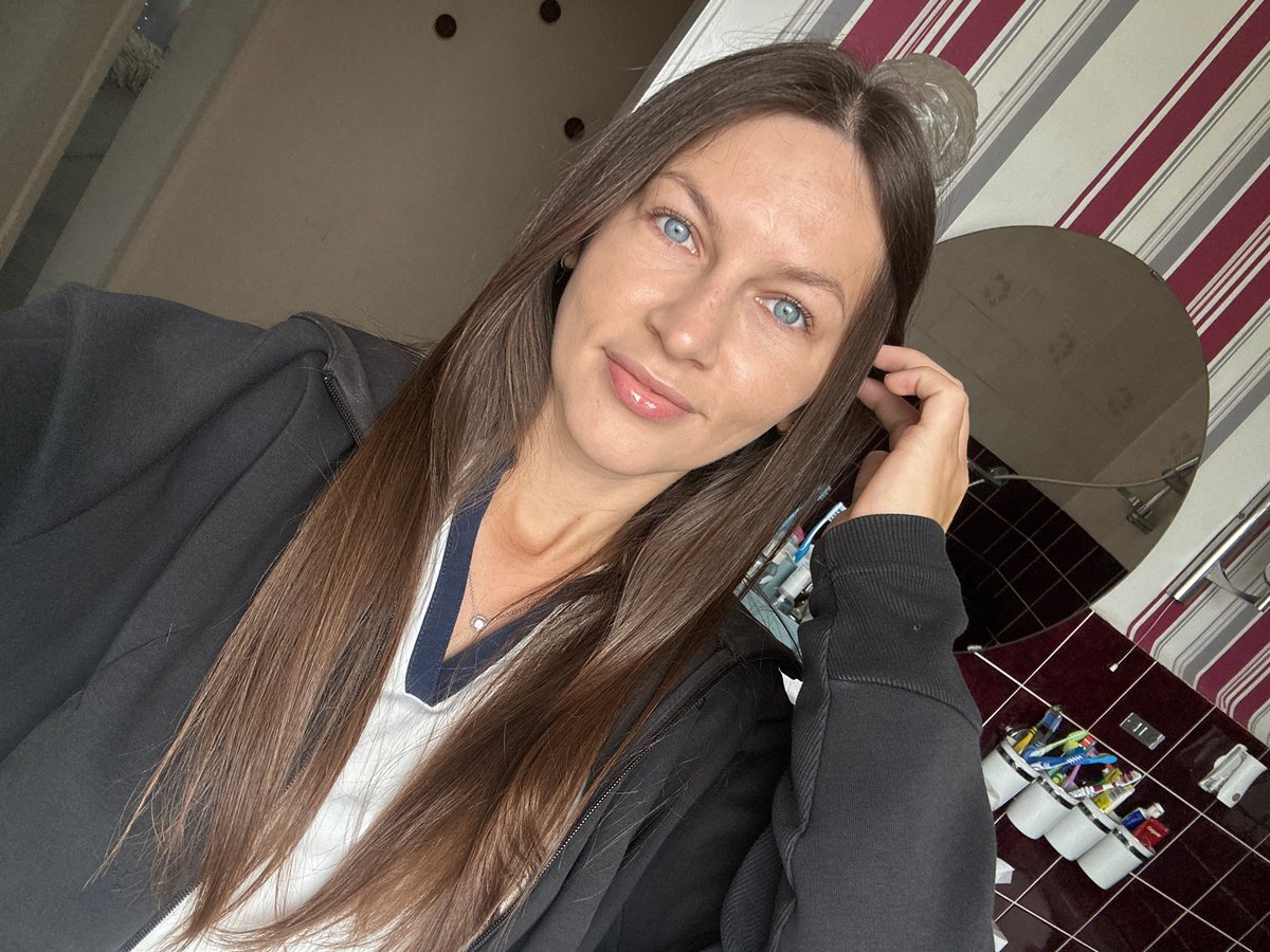 Woman Takes Multiple Selfies in Fredenbeck Germany Morning Session
