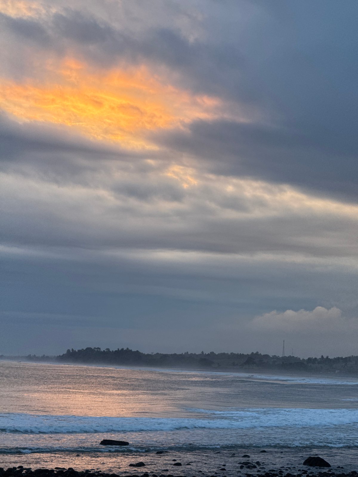 Two girls pose on beach during sunrise moment