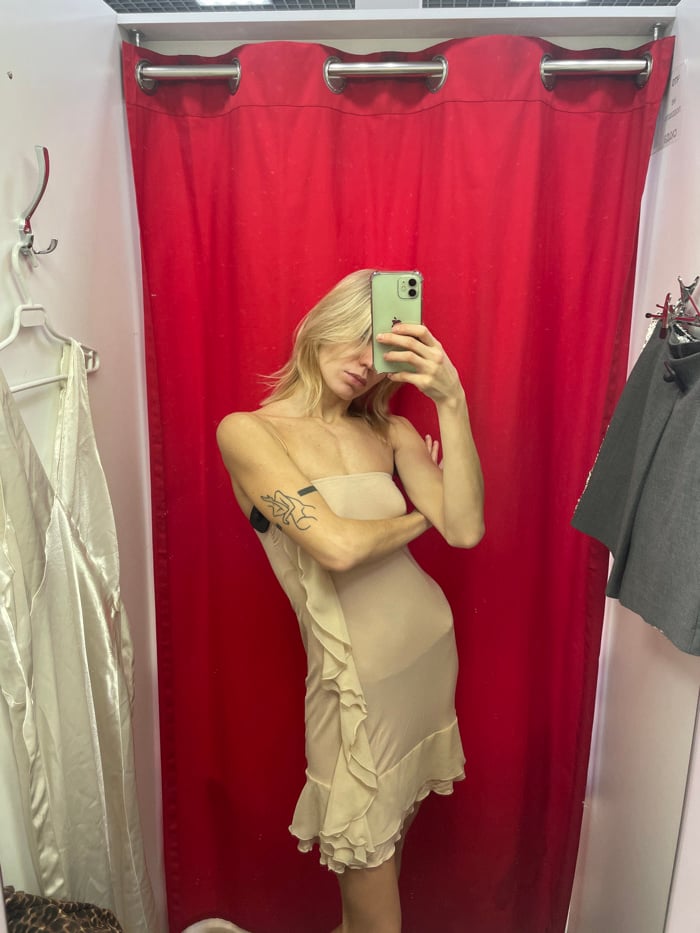 Person tries on dresses in Moscow fitting room