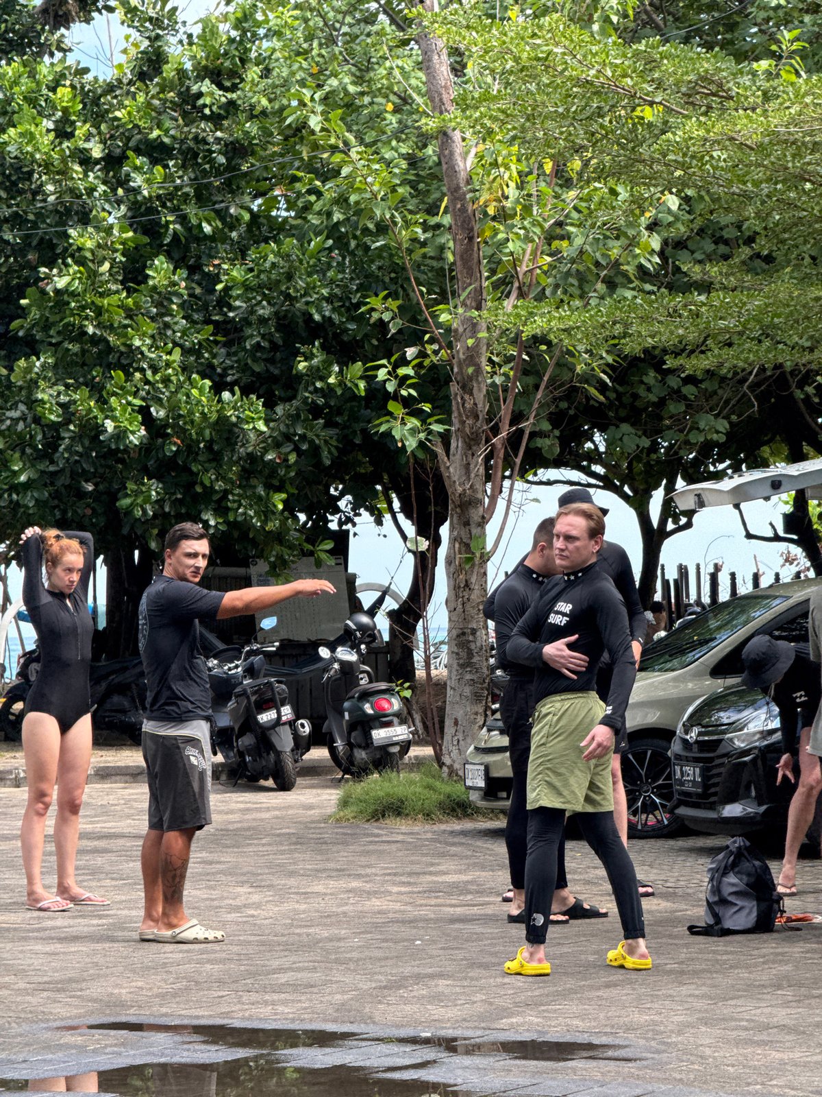 Group observed stretching, warming up in sunny Kuta