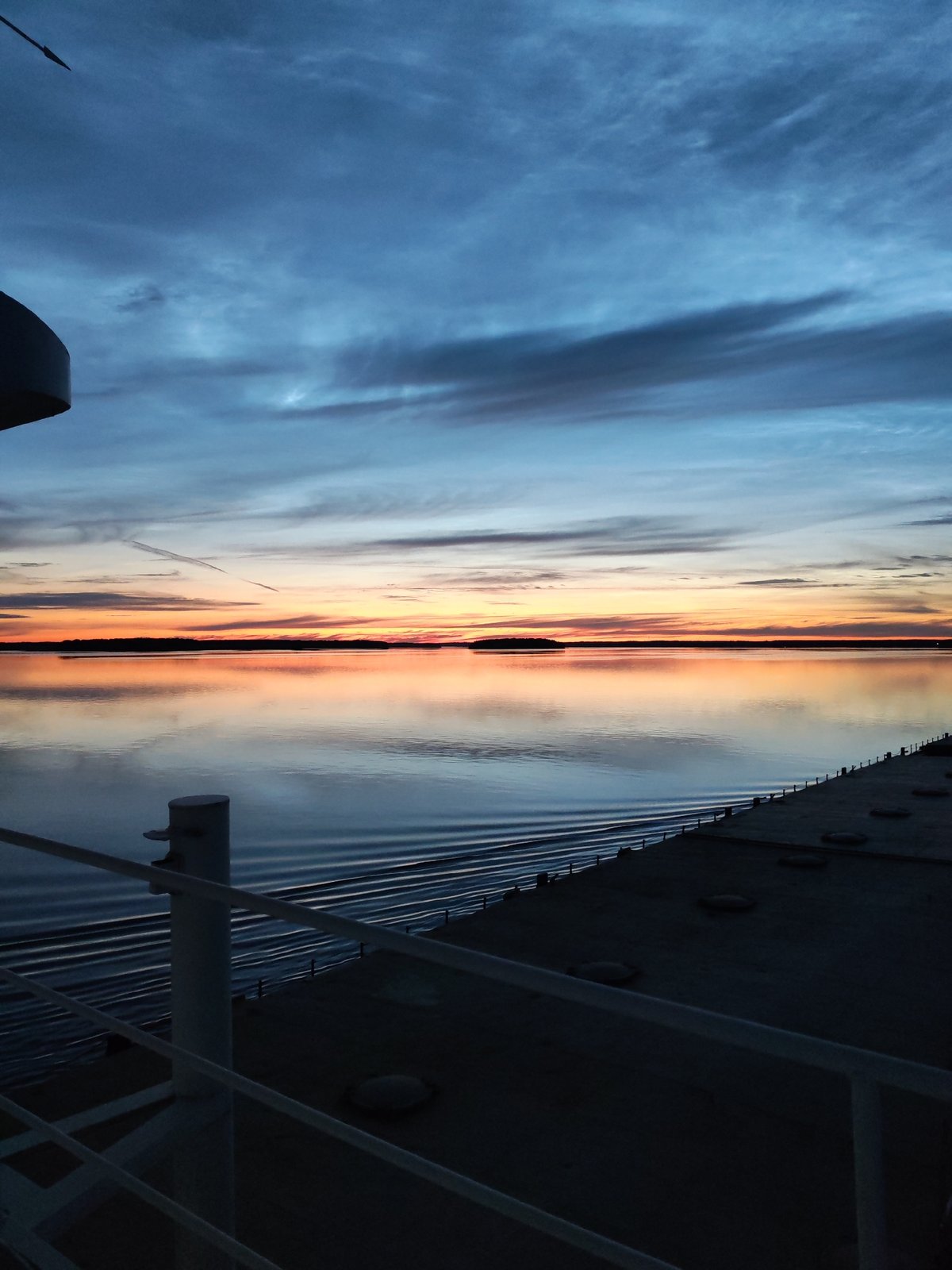 Dusk on the water: ship deck views near Malinukha, Russia
