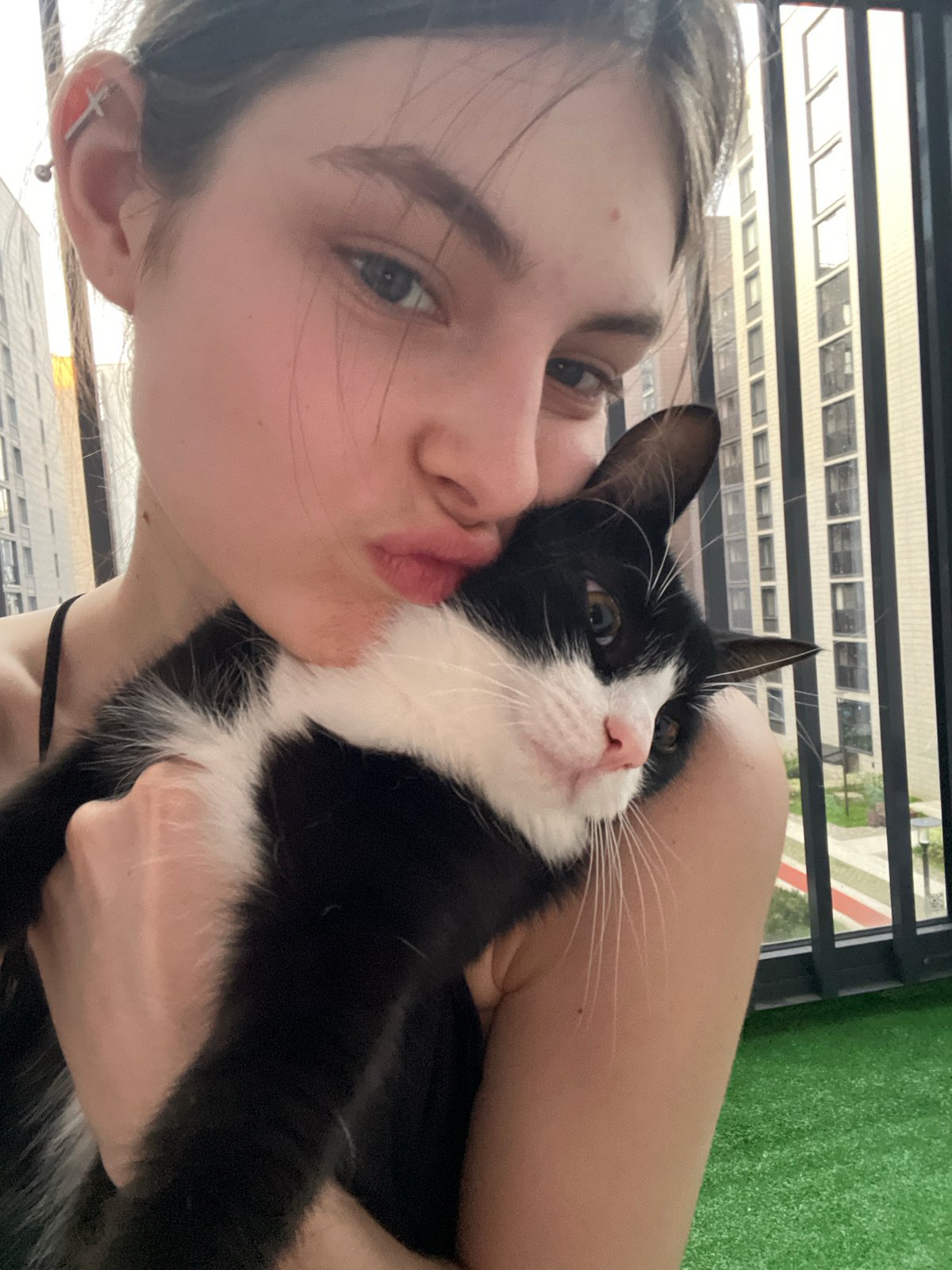 Woman shares quiet moments with cat in Saint Petersburg apartment