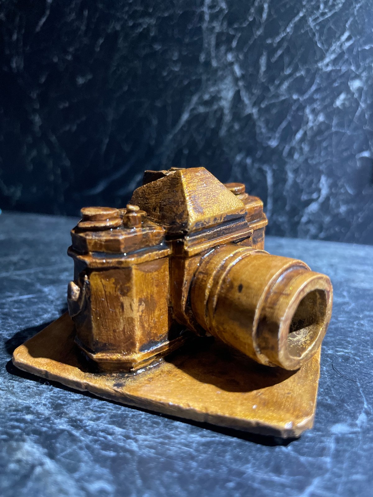 Person documents miniature collectibles and TV displays in Kazan