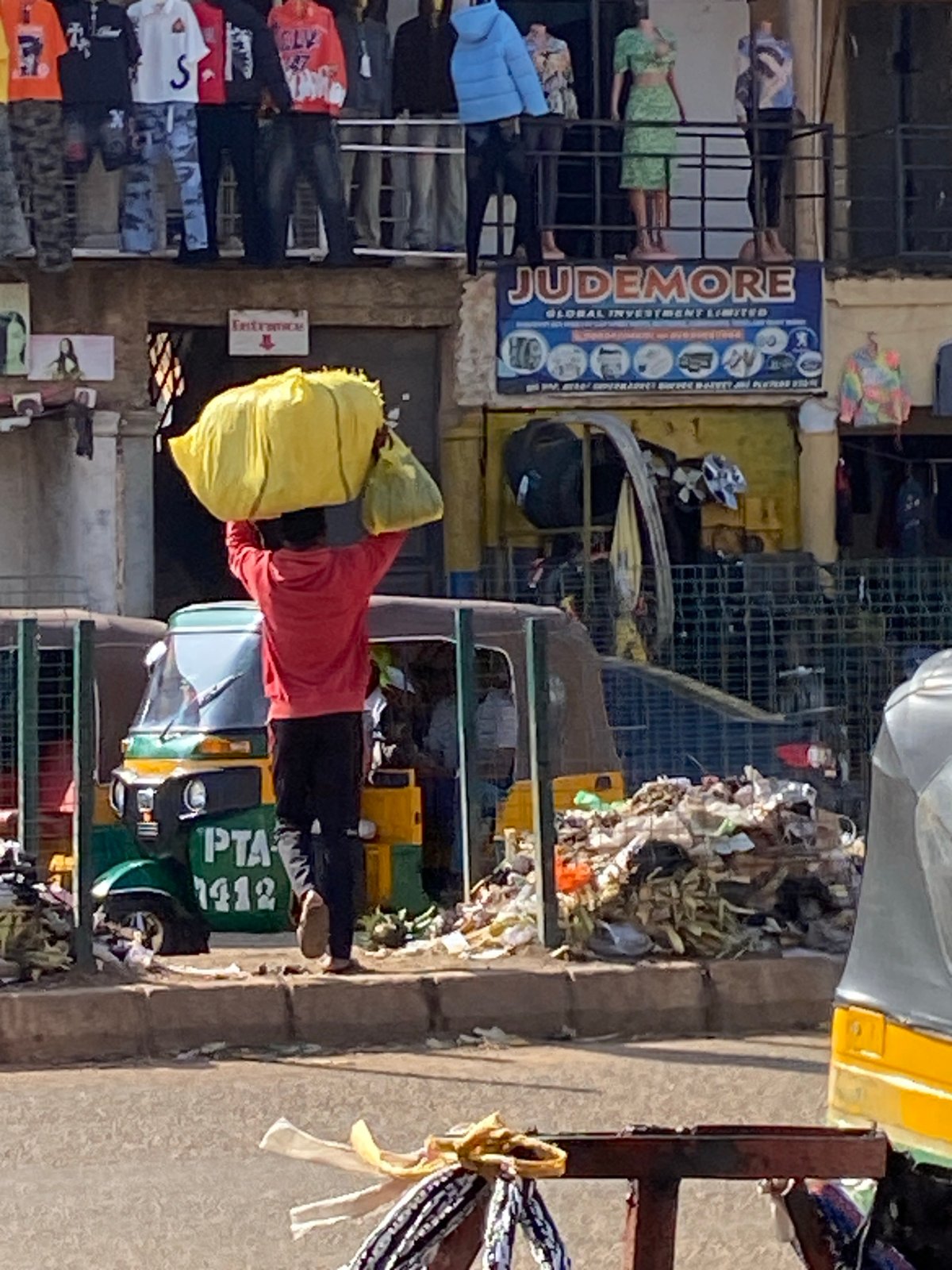 Morning street life and commerce in Bukuru, Nigeria