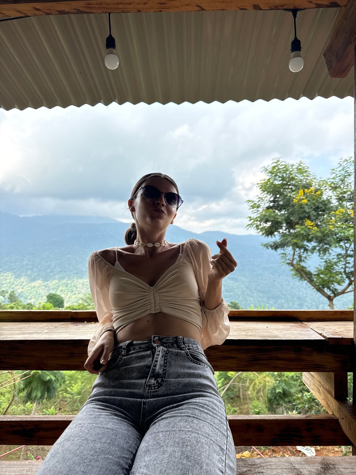 Woman enjoys morning photo session at Vietnamese mountain viewpoint