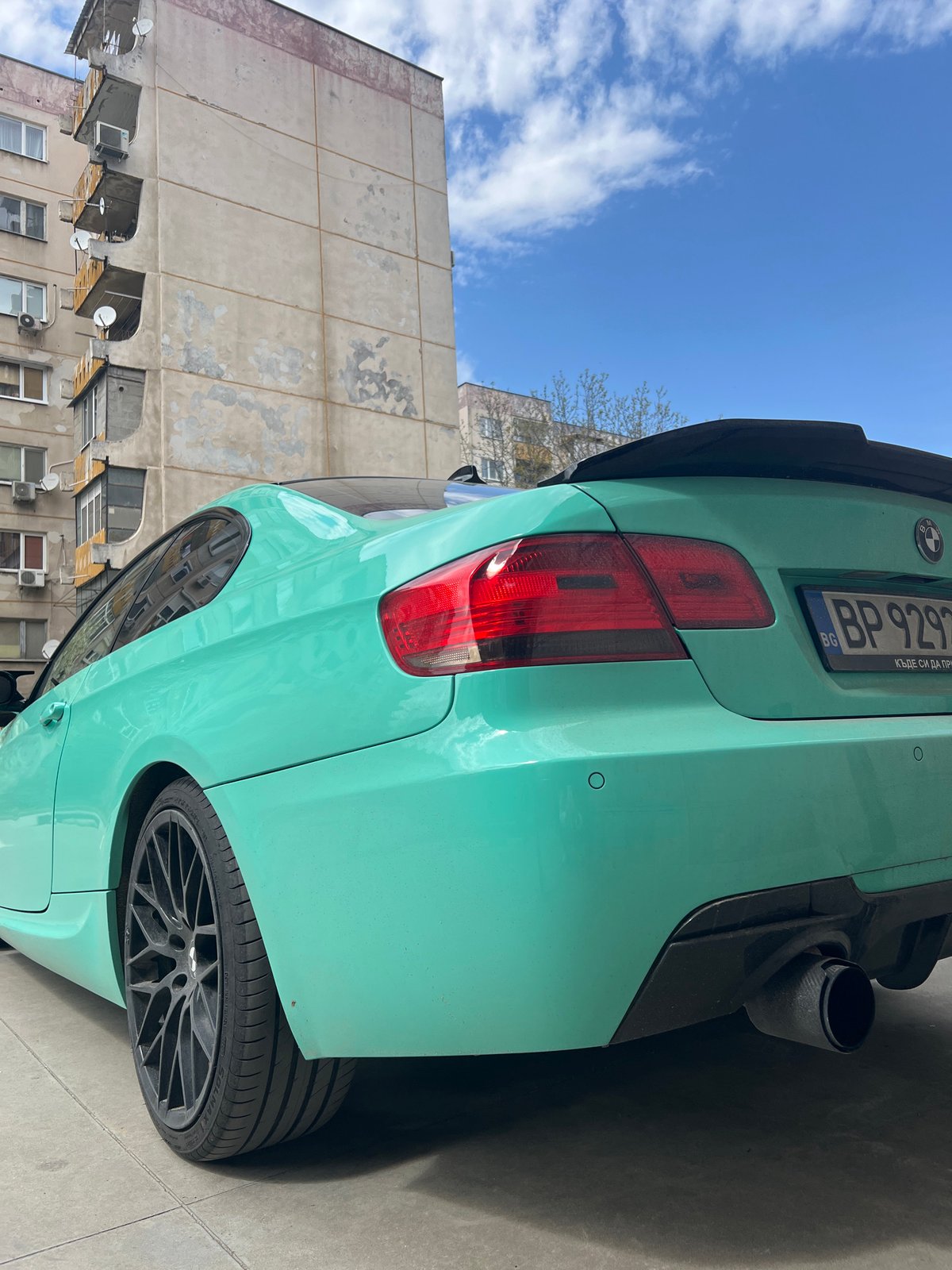 Mint green BMW, elevator selfie captured in Plovdiv street scenes