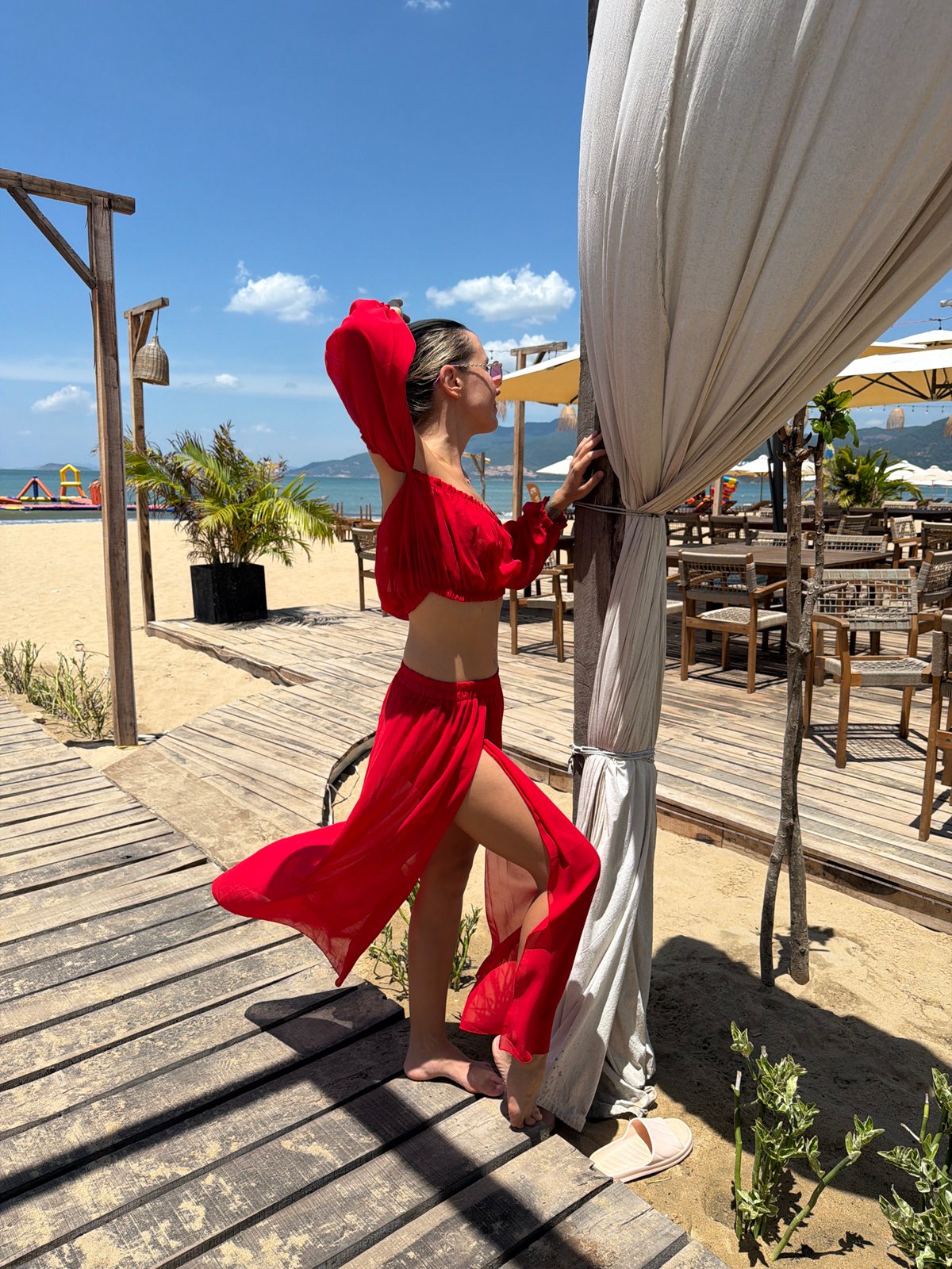 Red beach outfit, Quy Nhon resort boardwalk and shoreline