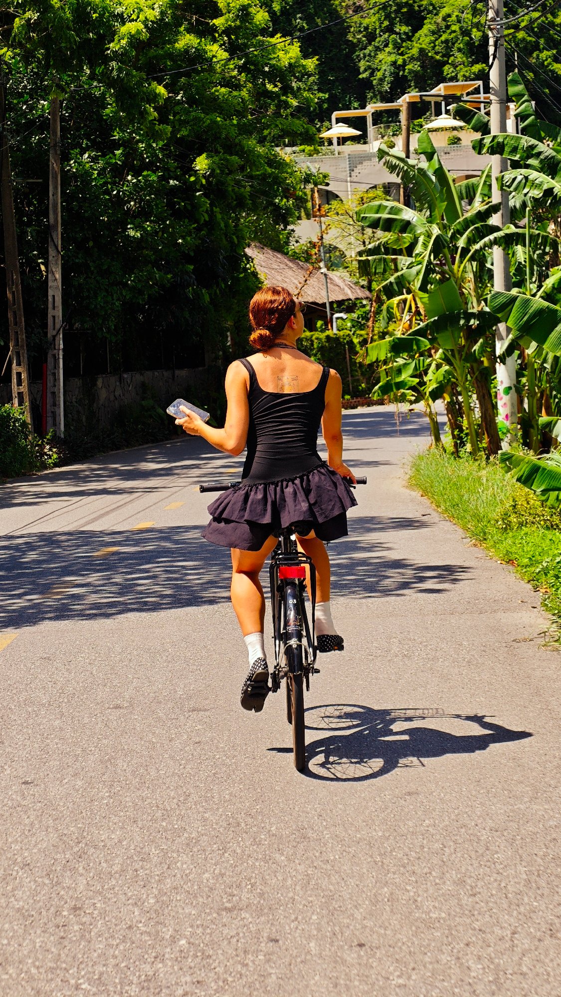 Cyclist spotted on curved mountain road in Vietnam