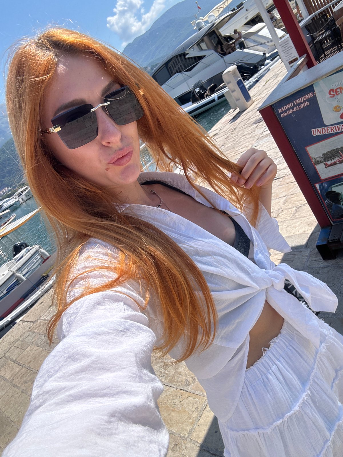 Tourist documents morning visit to Budva marina and monuments