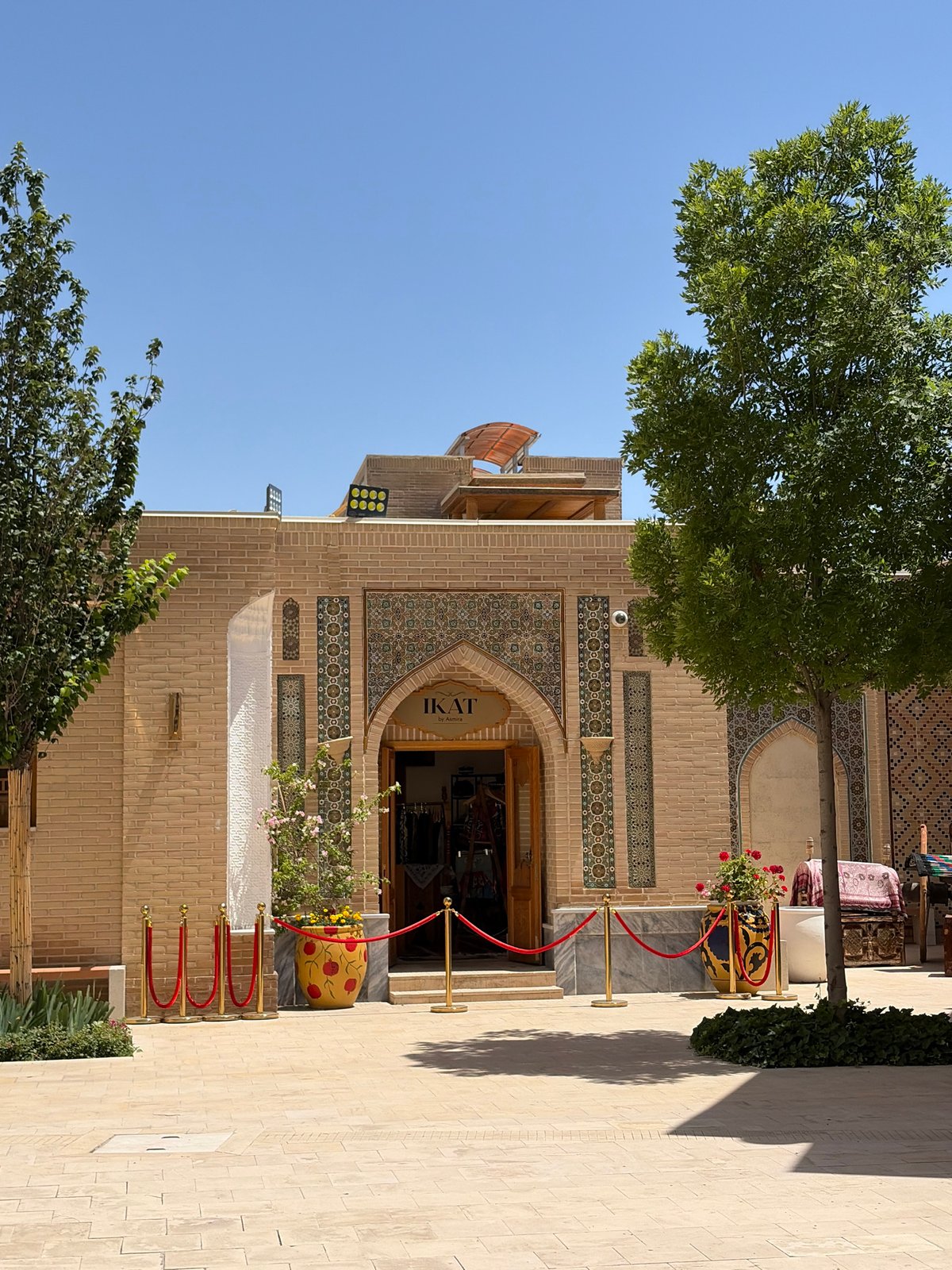 Tourist explores traditional architecture and markets in Kuchtumgali, Uzbekistan