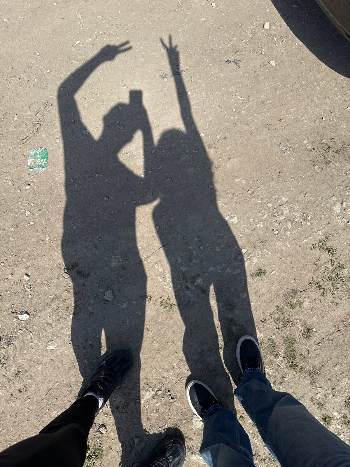 Two people flash peace signs in Bulgarian countryside