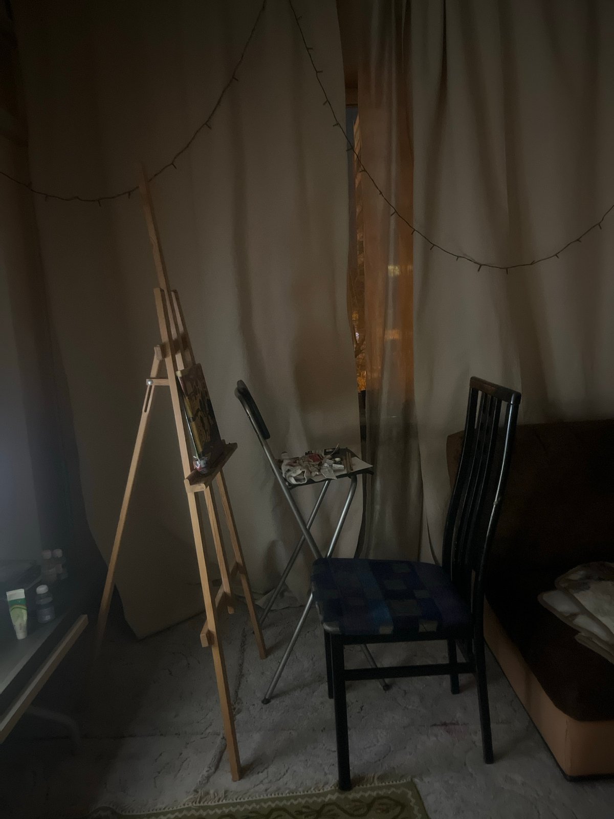 Creative studio space with easel documented in Krasnoyarsk