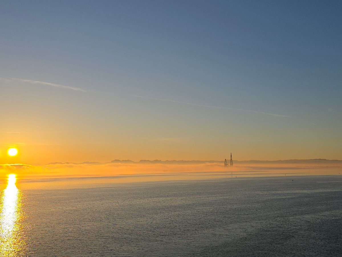 Dawn breaks over foggy Norwegian coastline near Randaberg
