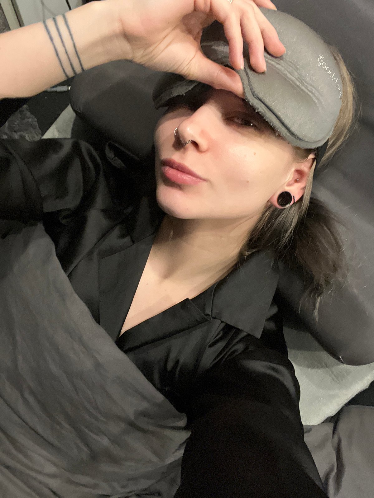 Person photographed in bed during early morning in Khimki