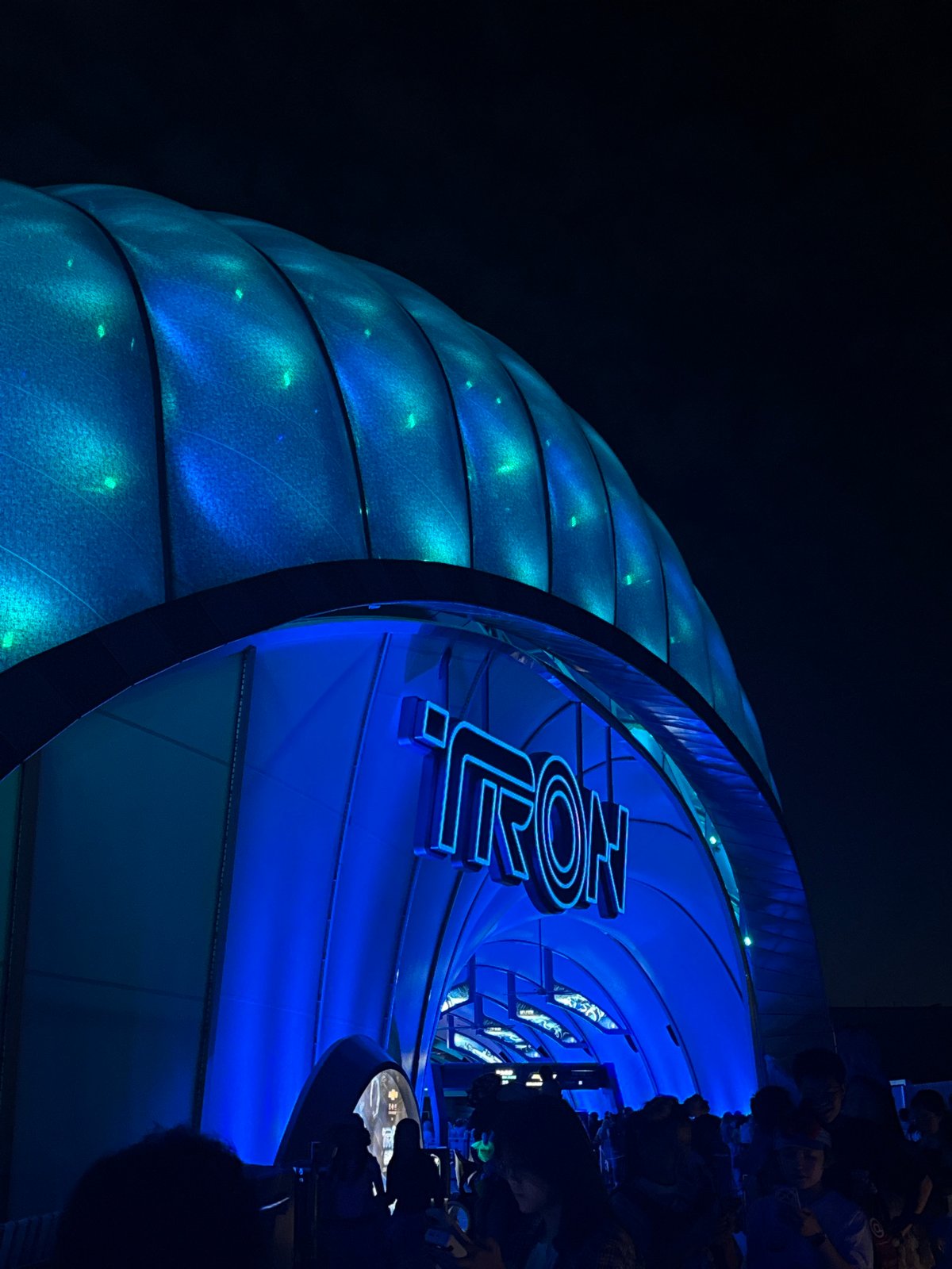 Shanghai Disneyland visitors photograph TRON attraction during evening visit