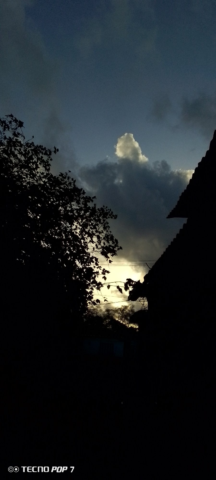 Dramatic skies and street life documented in Venezuelan town