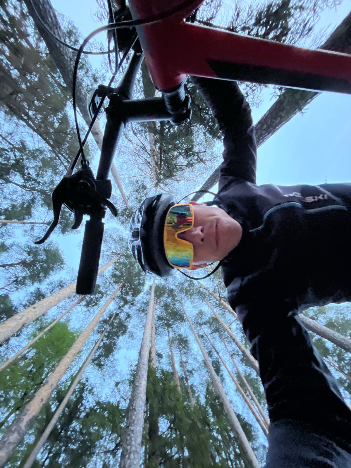 Mountain biker documents forest ride with creative selfies near Chaikovsky