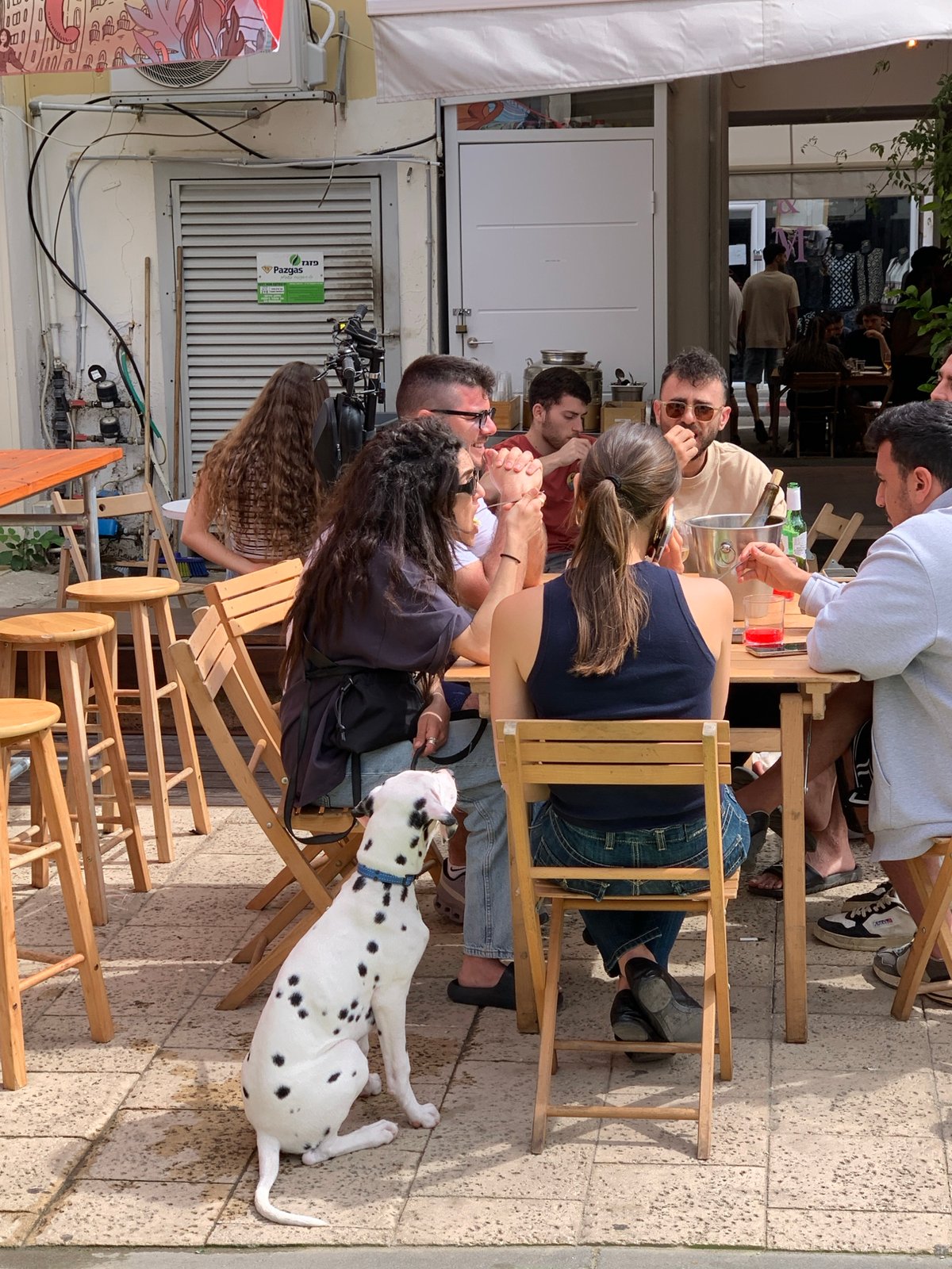 Outdoor dining scene captured at Tel-Aviv street cafe