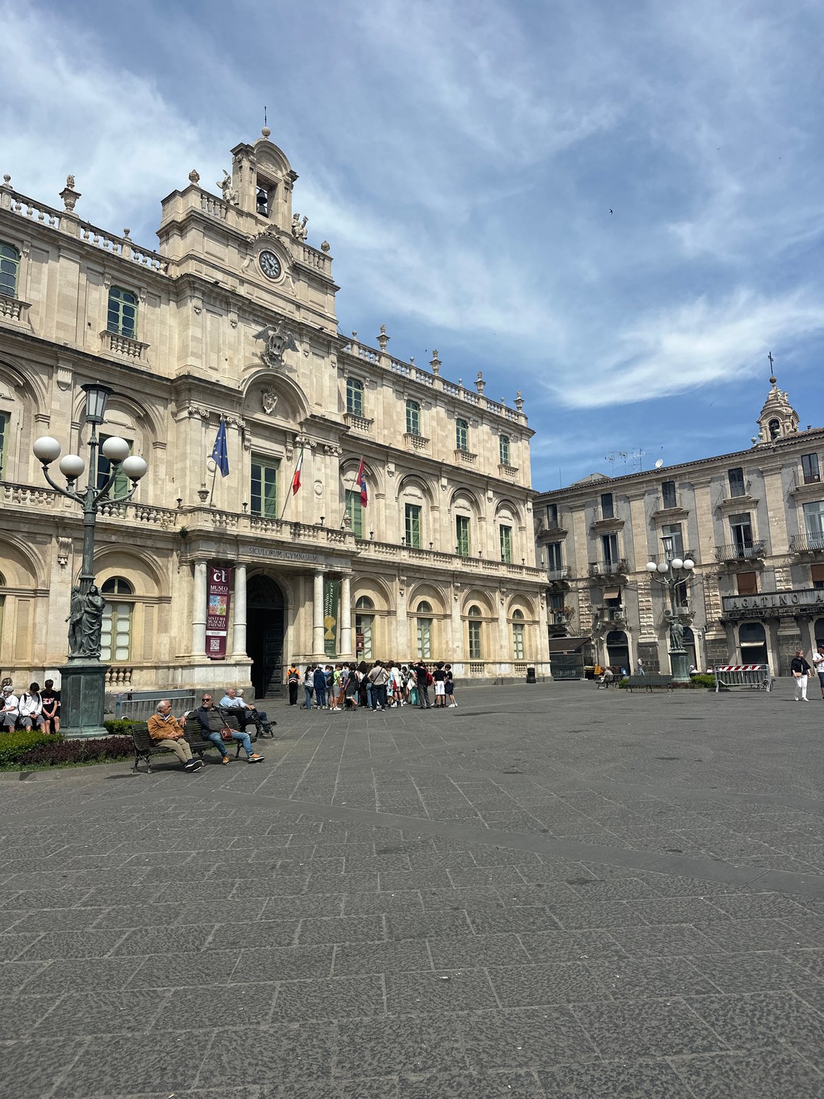Morning street life documented across central Catania, Italy