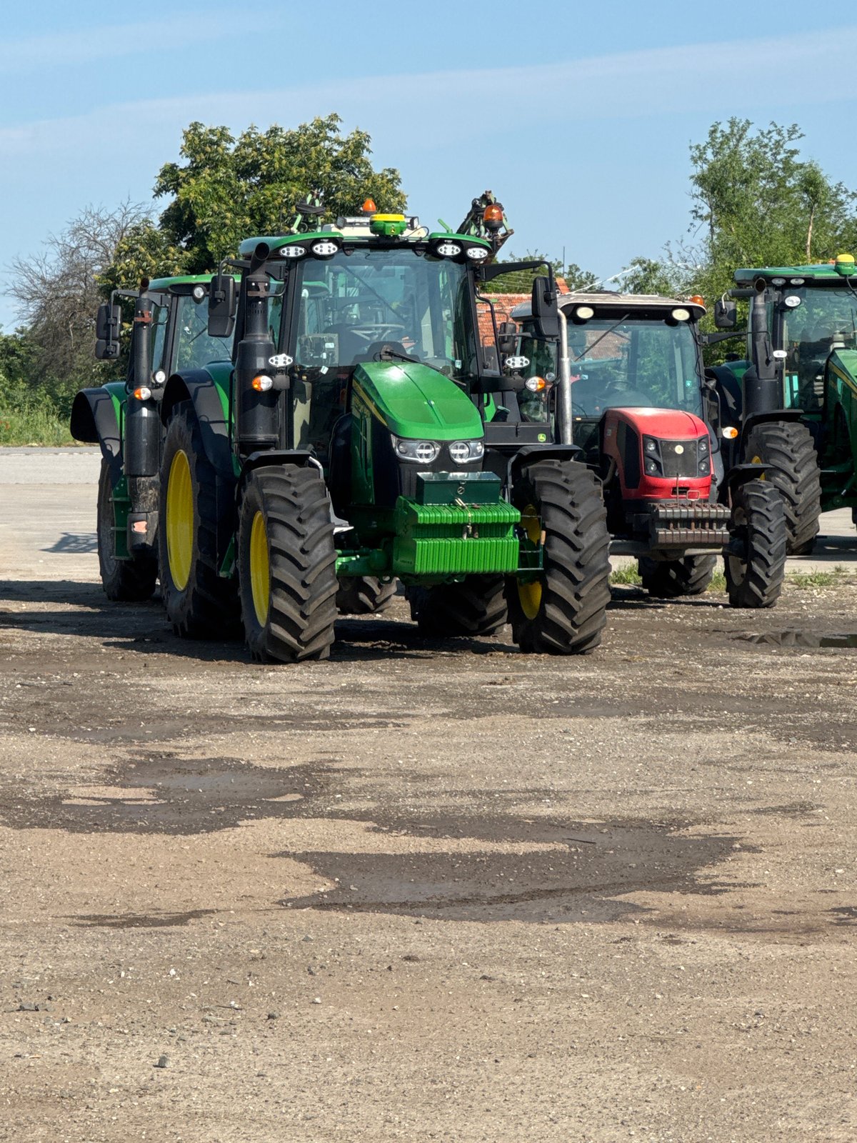 Farm equipment parked in rural Bulgarian village