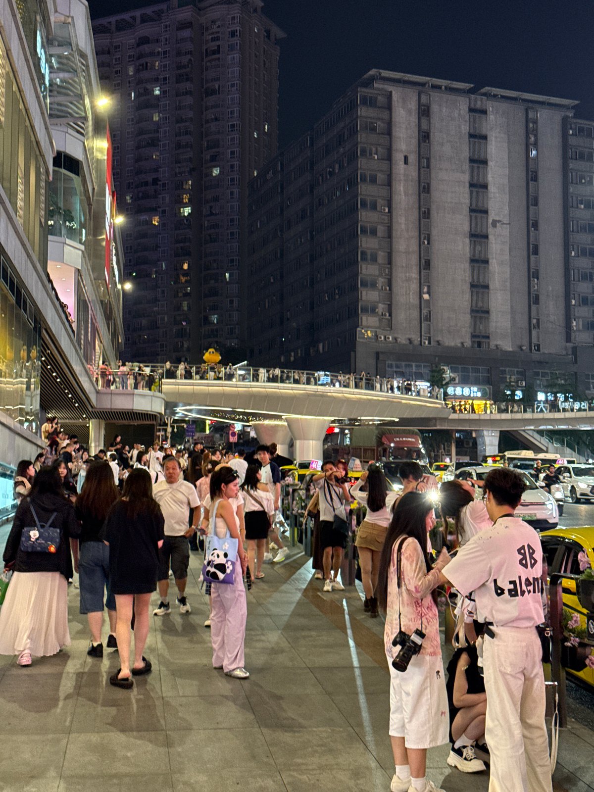 Busy evening street life captured across Liangjiang, China