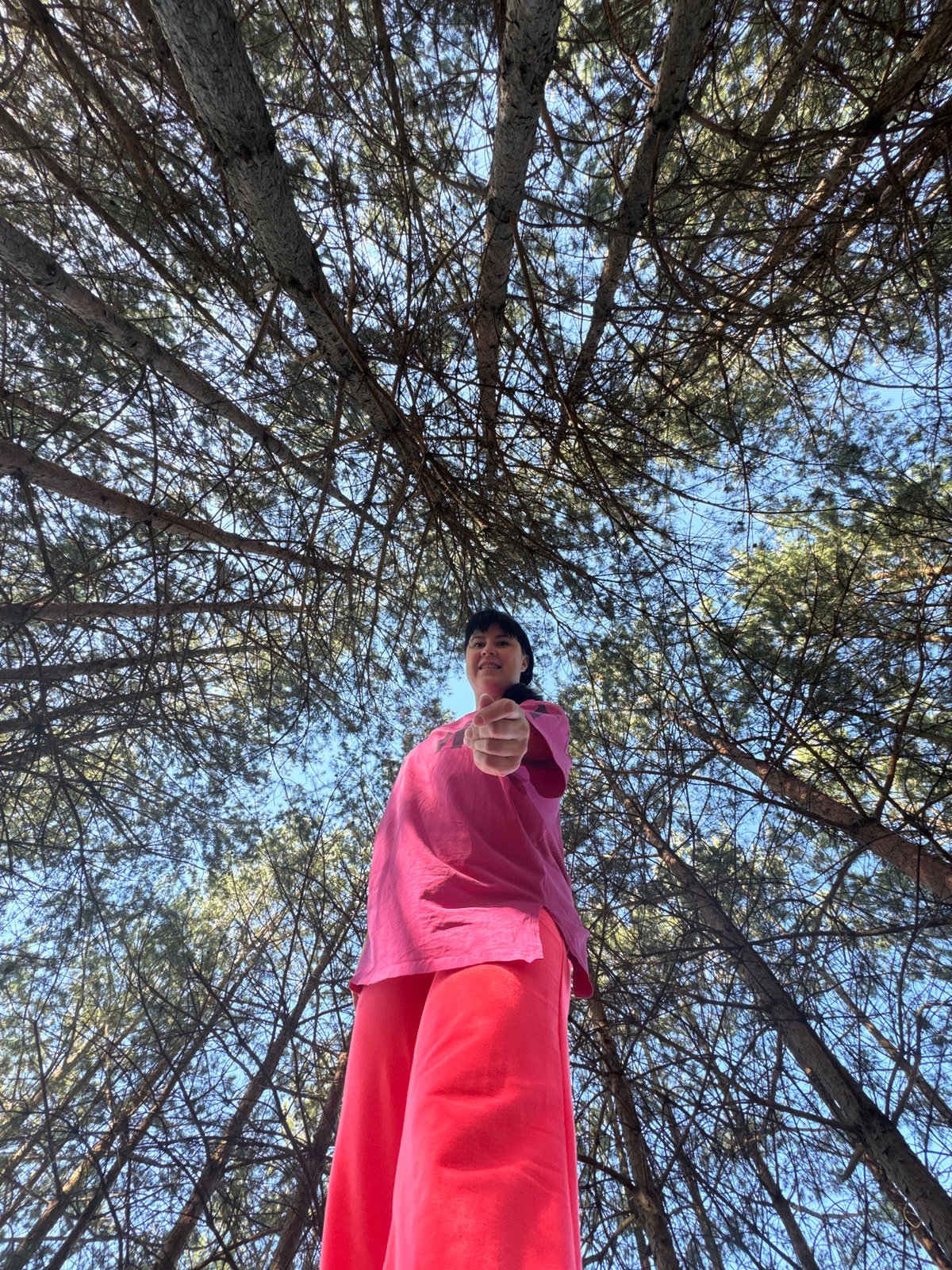 Person in pink shirt photographed in Russian forest