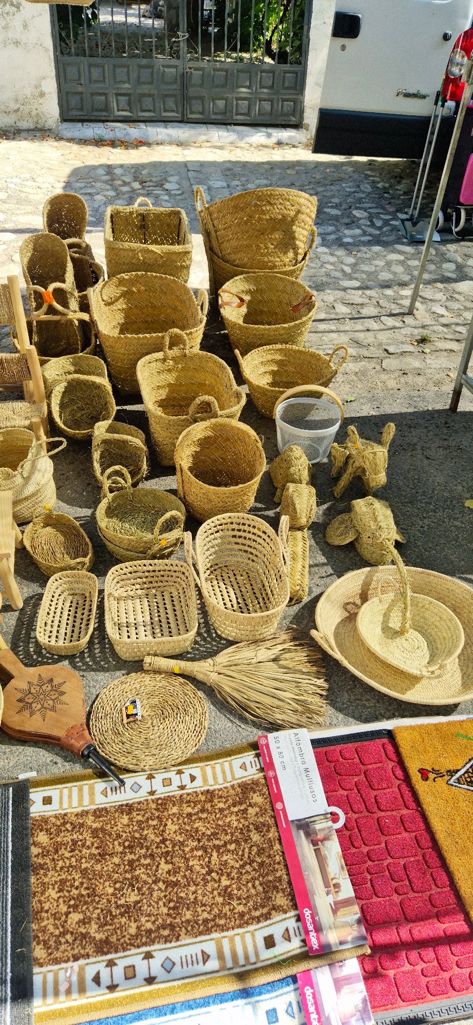 Street market in Navaluenga selling produce, clothes, and trinkets