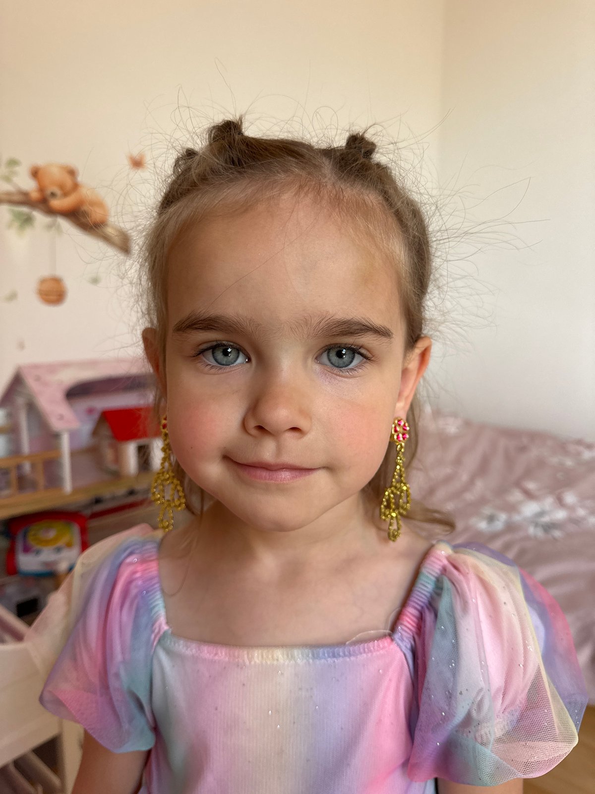 Young girl photographed smiling in colorful dress, Niederquembach