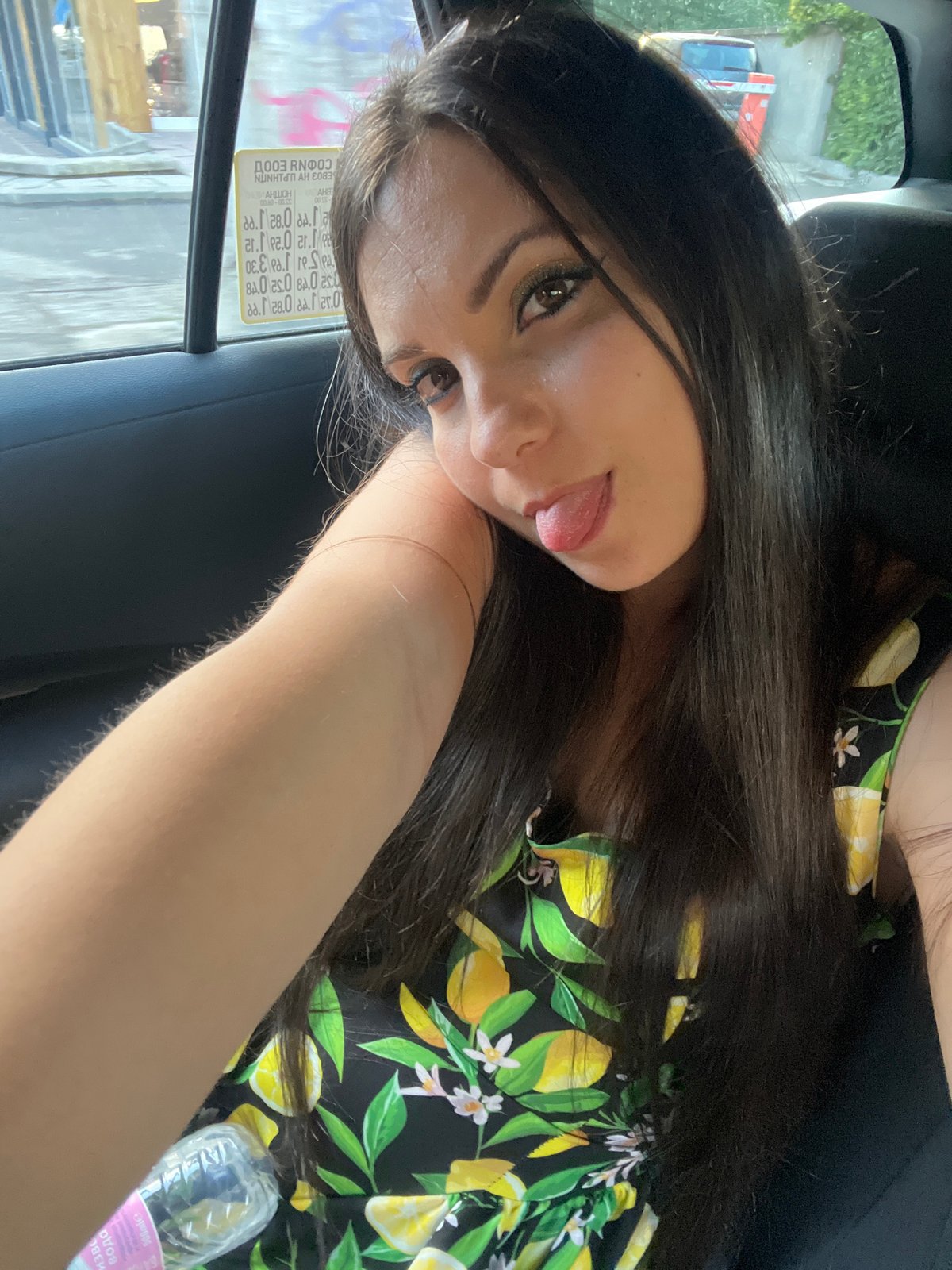 Backseat moment in Sofia, playful look at the camera.