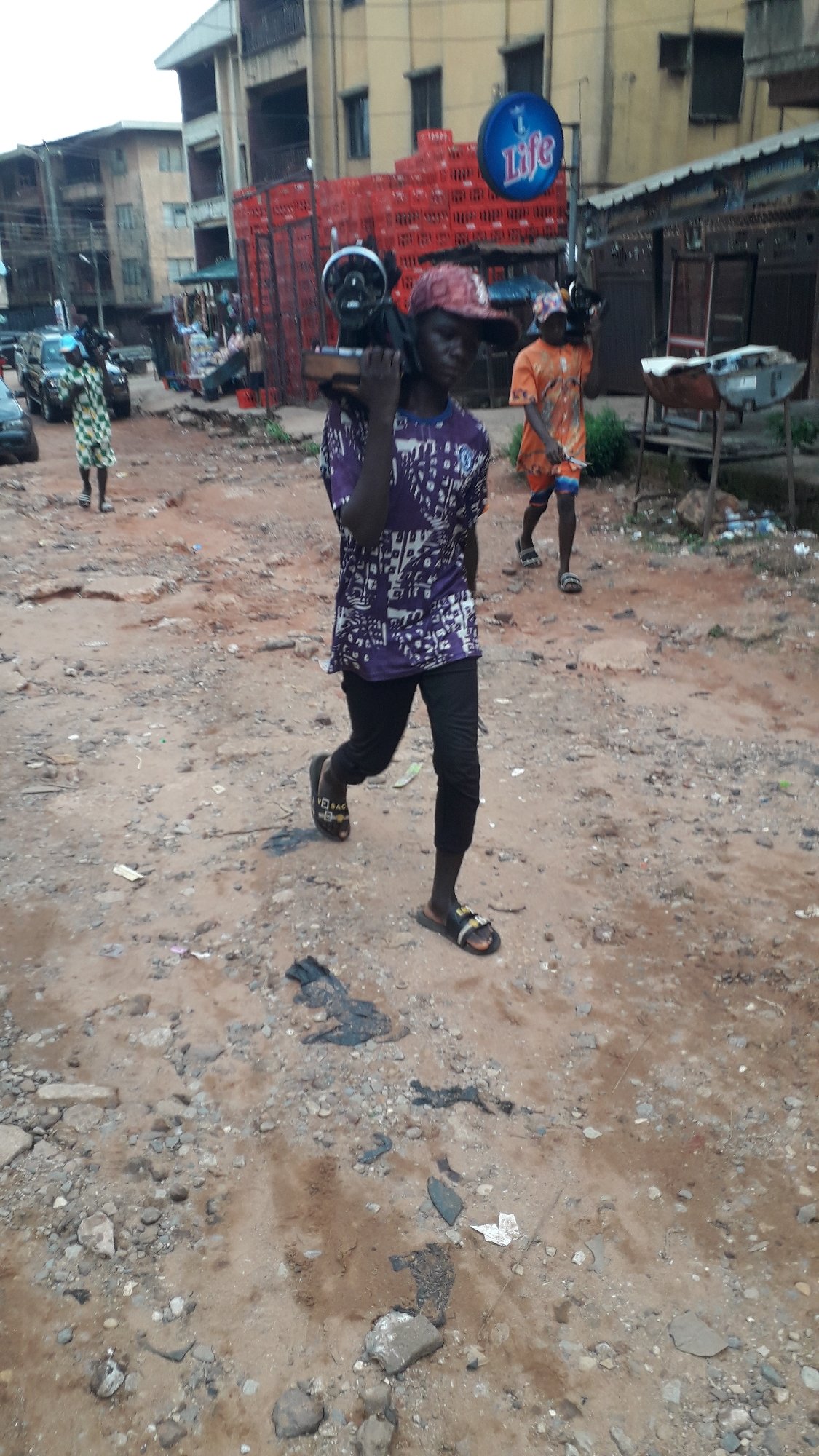 Morning street life documented across Onitsha, Nigeria neighborhoods