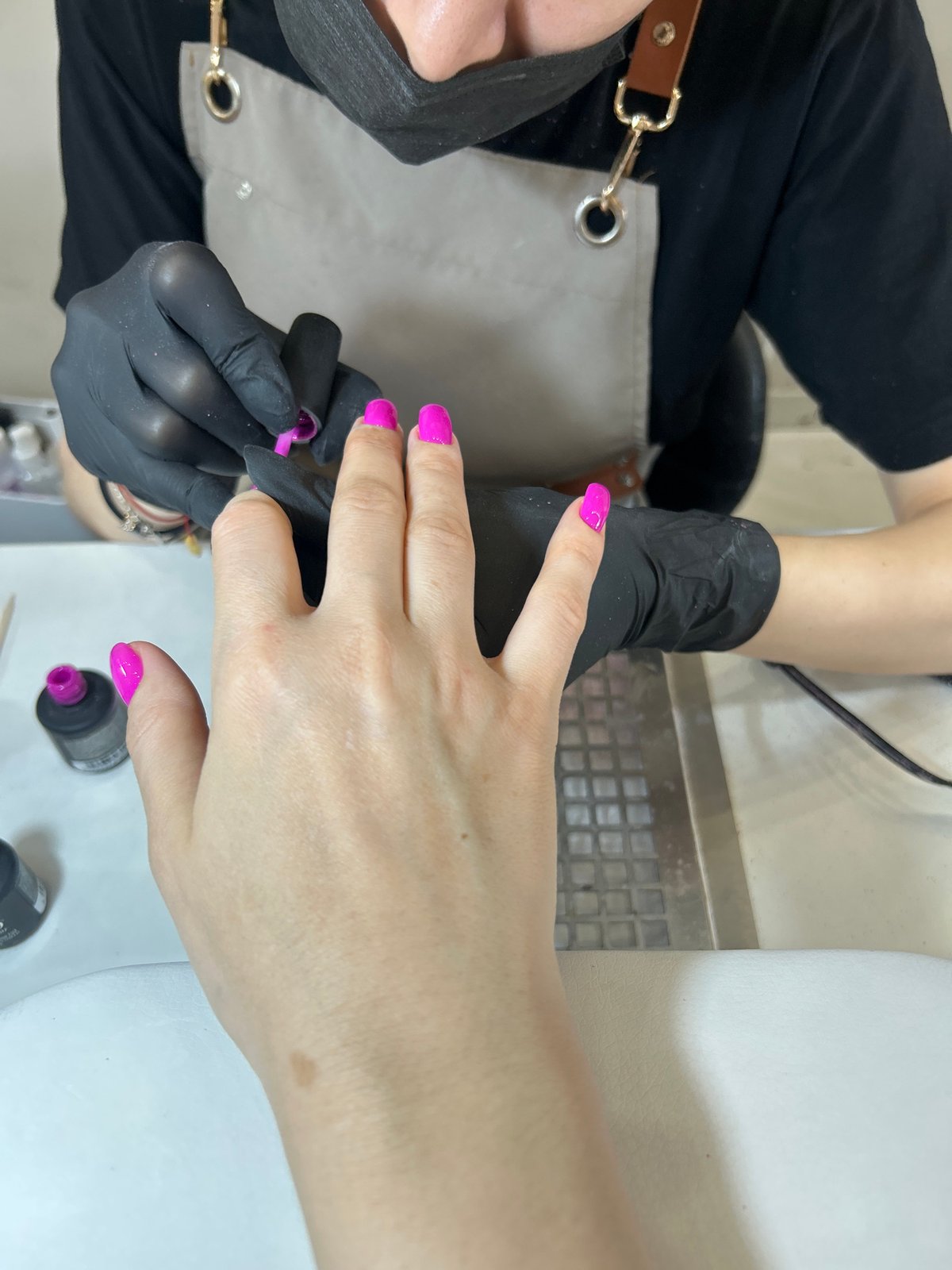Beauty service: Pink manicure session observed in Moscow salon