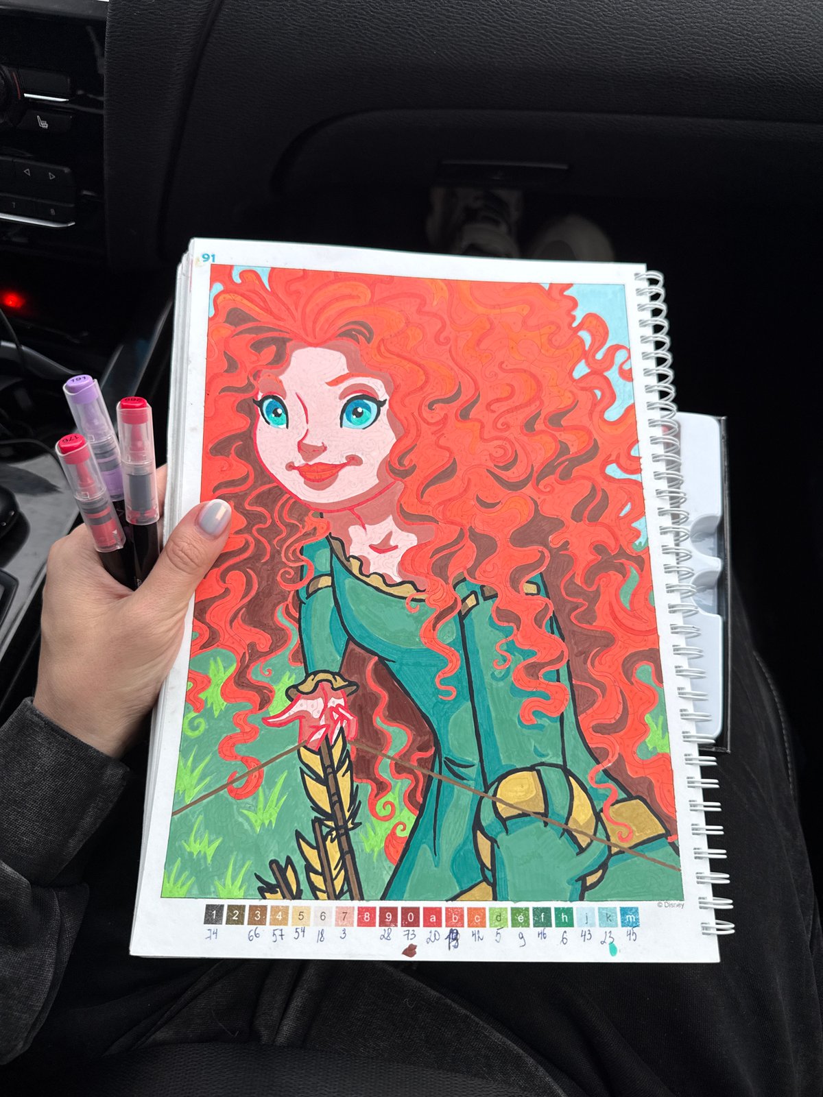 Person works on Disney Merida coloring page in Russia