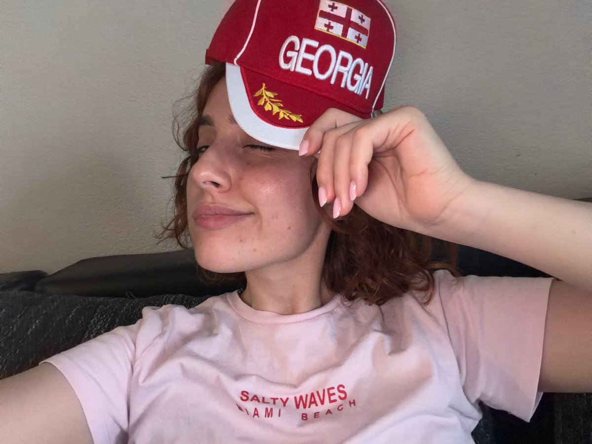 Casual café morning in Strasbourg with food and a Georgia cap