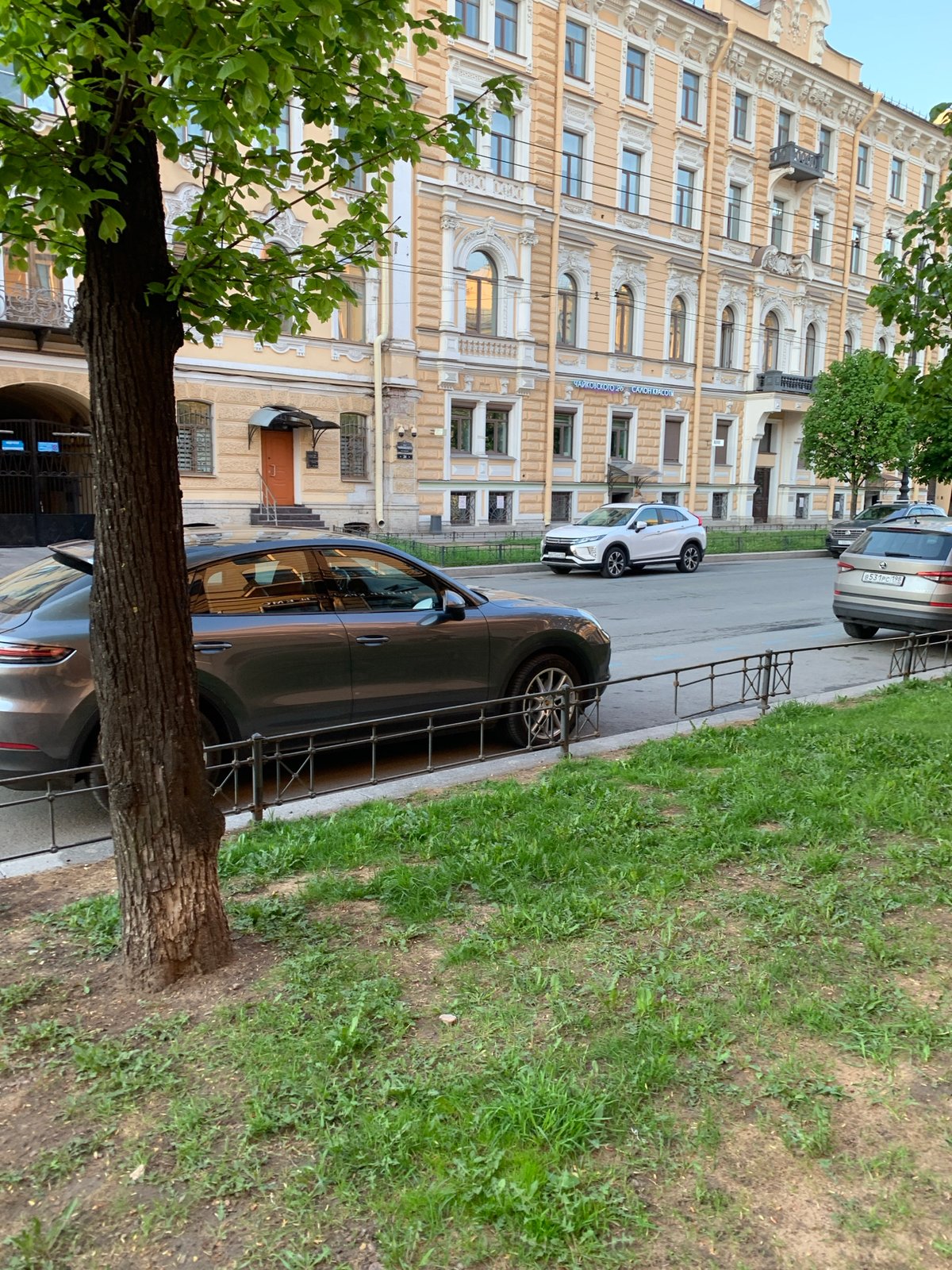 Ornate yellow building documented in Saint Petersburg street scene