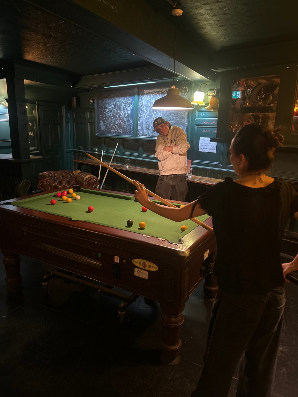 London pub payment terminals display quirky saxophone-playing animal graphics
