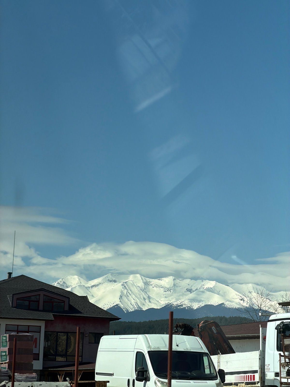 Spring morning view of snow-capped mountains in Kraishte, Bulgaria