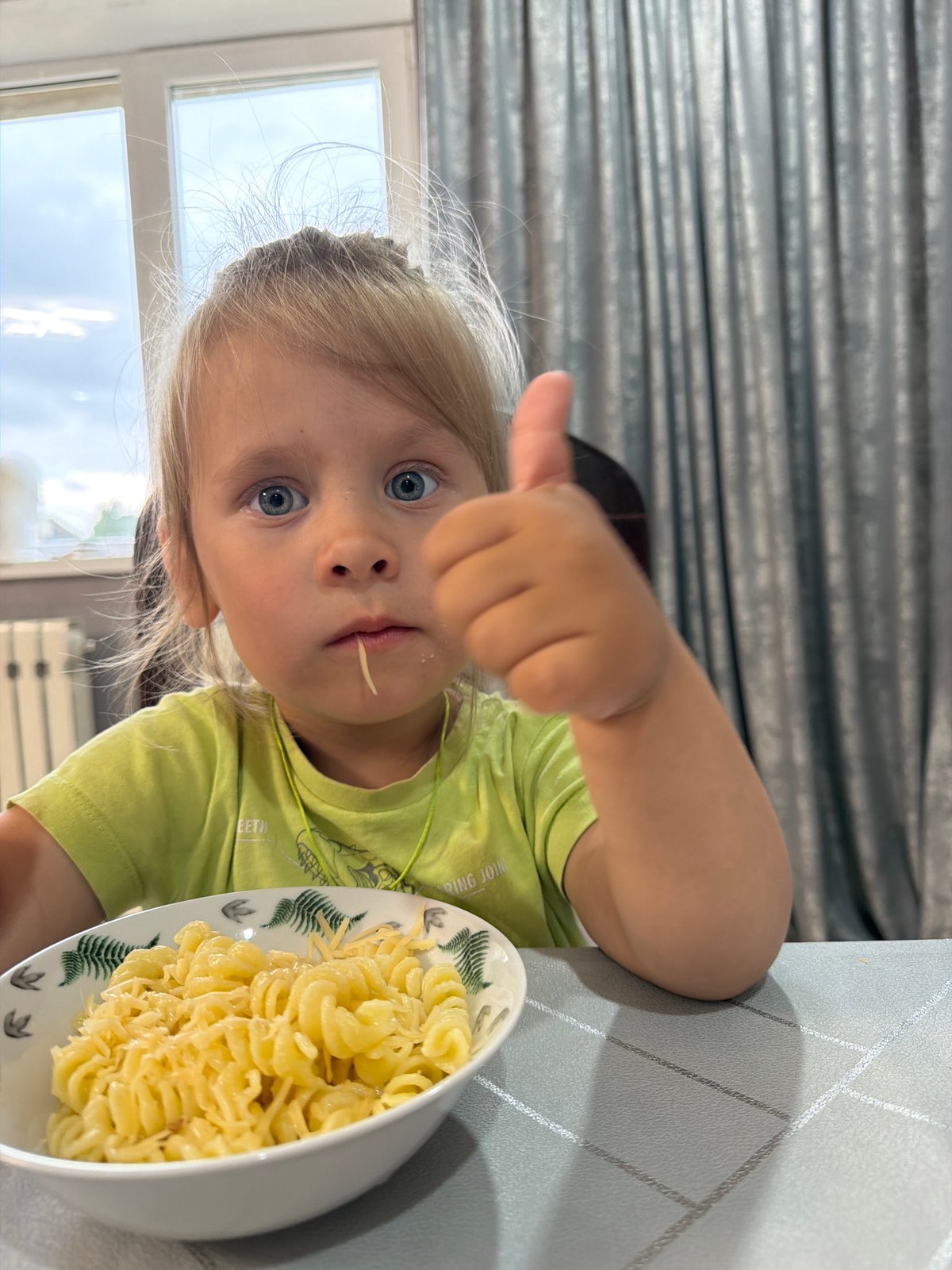 Laid-back morning at home — kids, pasta, and a cat