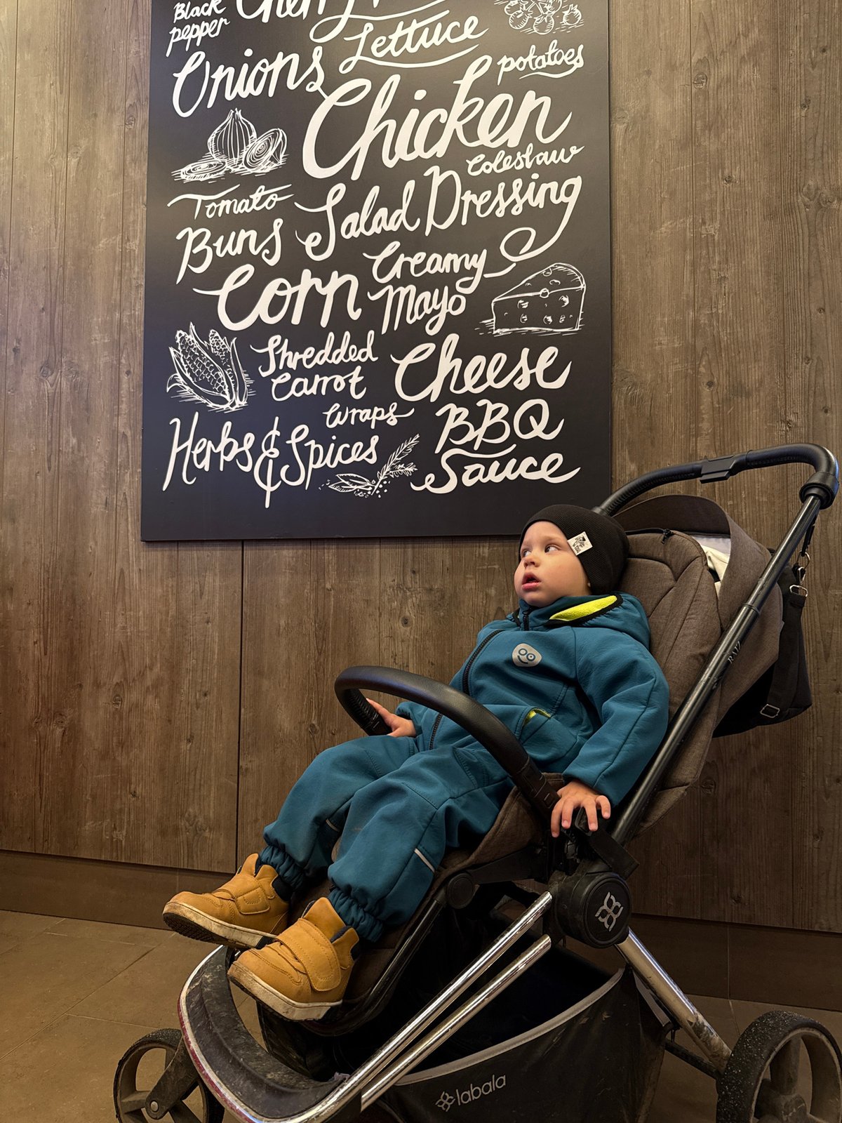 Family dining at Russian fast-food restaurant with toddler