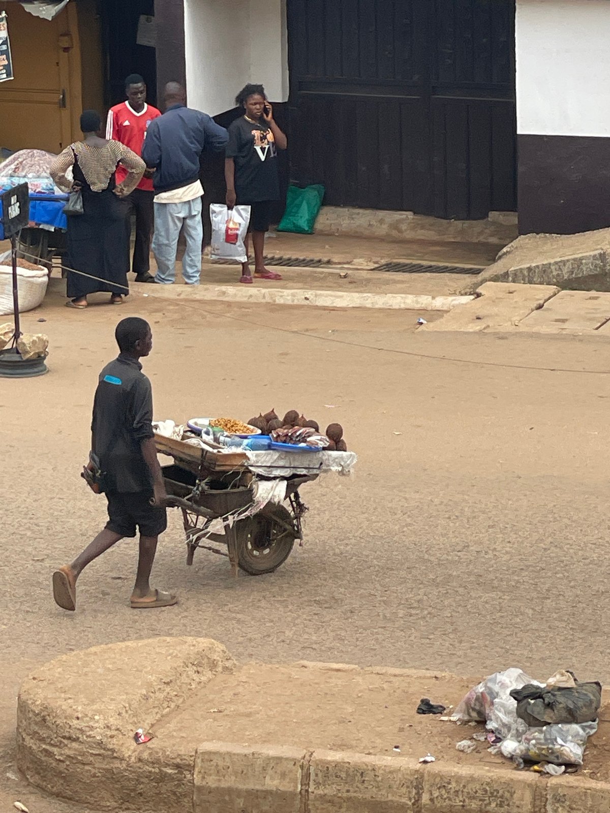 Outdoor market activity documented in unidentified urban area
