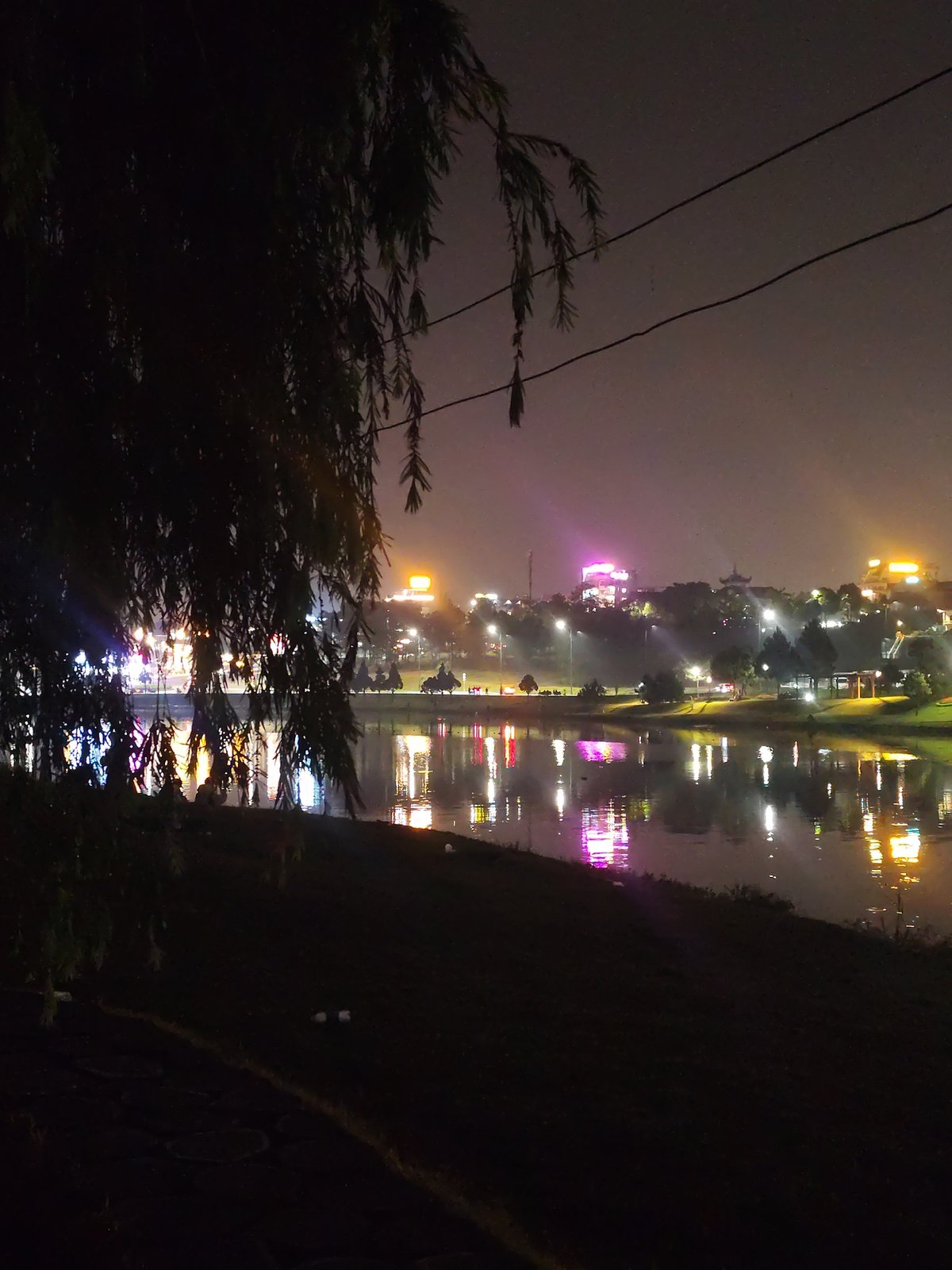 Night fishing captured at illuminated Da Lat lake