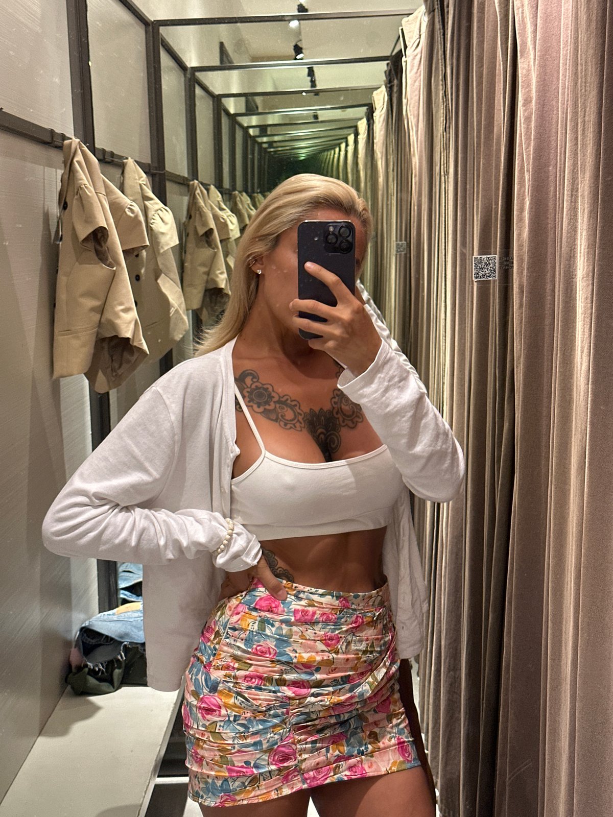 Trying on outfits in Kuta, with a Barong mask sighting nearby