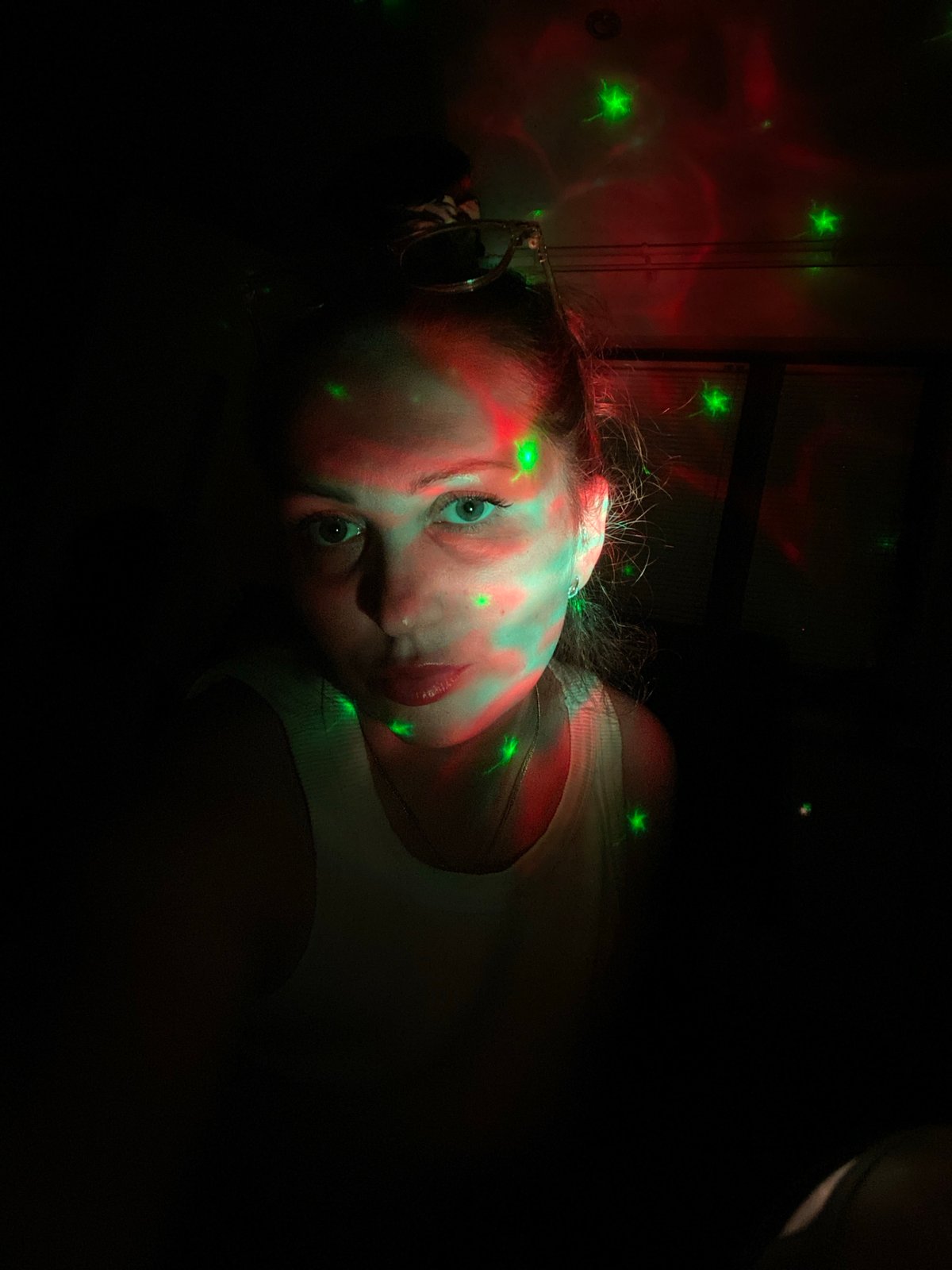 Woman photographed in colored lighting in Markovský, Russia