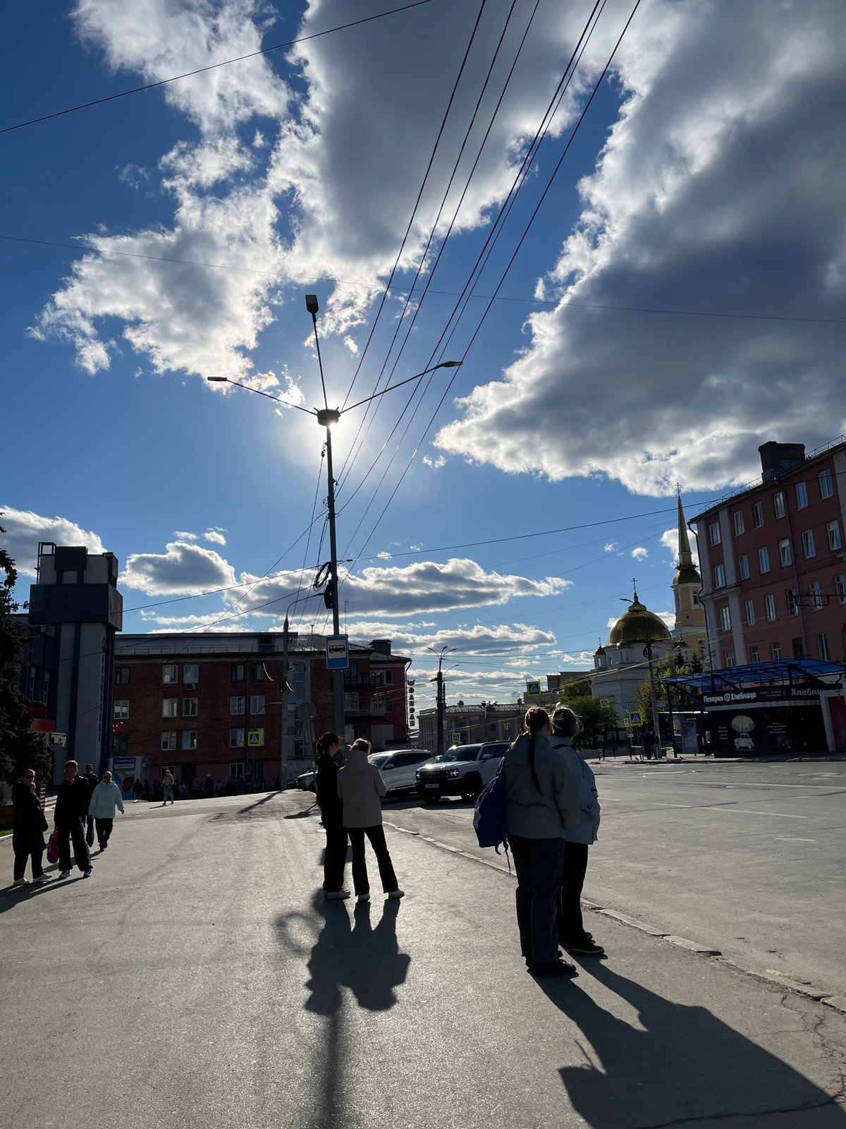 Clear skies and Orthodox church observed in Izhevsk street scene